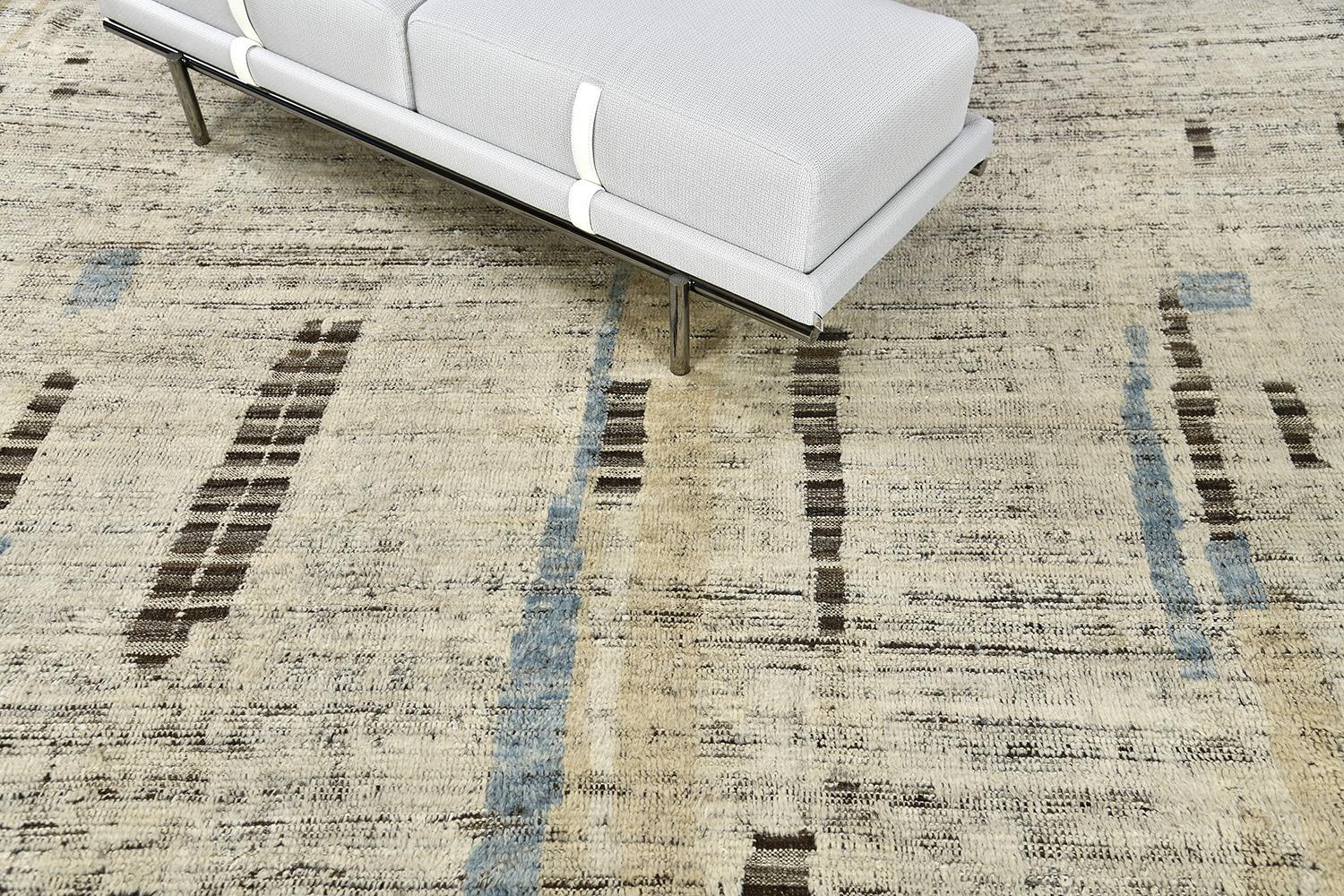 Nakhla is a natural earth-toned rug and a modern interpretation of the Moroccan world. This rugs irregular ivory, khaki, and salt and pepper strokes resemble the fibers of nature and their ability to be used for crafts such as cords and basketry.