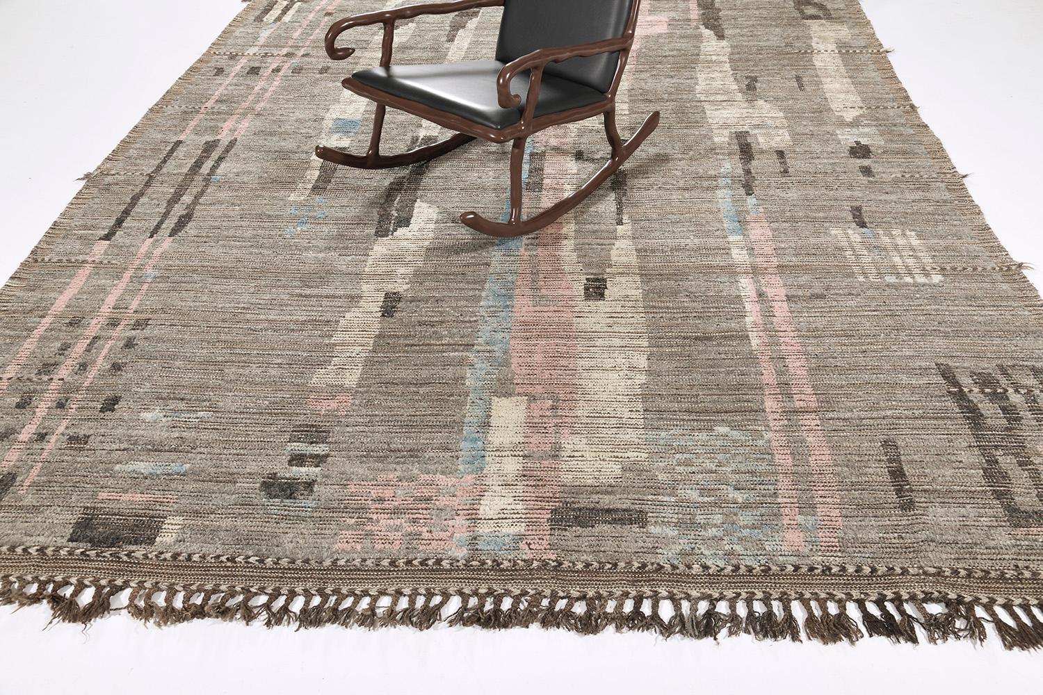 Nakhla is a natural earth-toned rug and a modern interpretation of the Moroccan world. These rugs' irregular patches of gray, pink, blue, and gray resemble the fibers of nature and their ability to be used for crafts such as cords and basketry.
