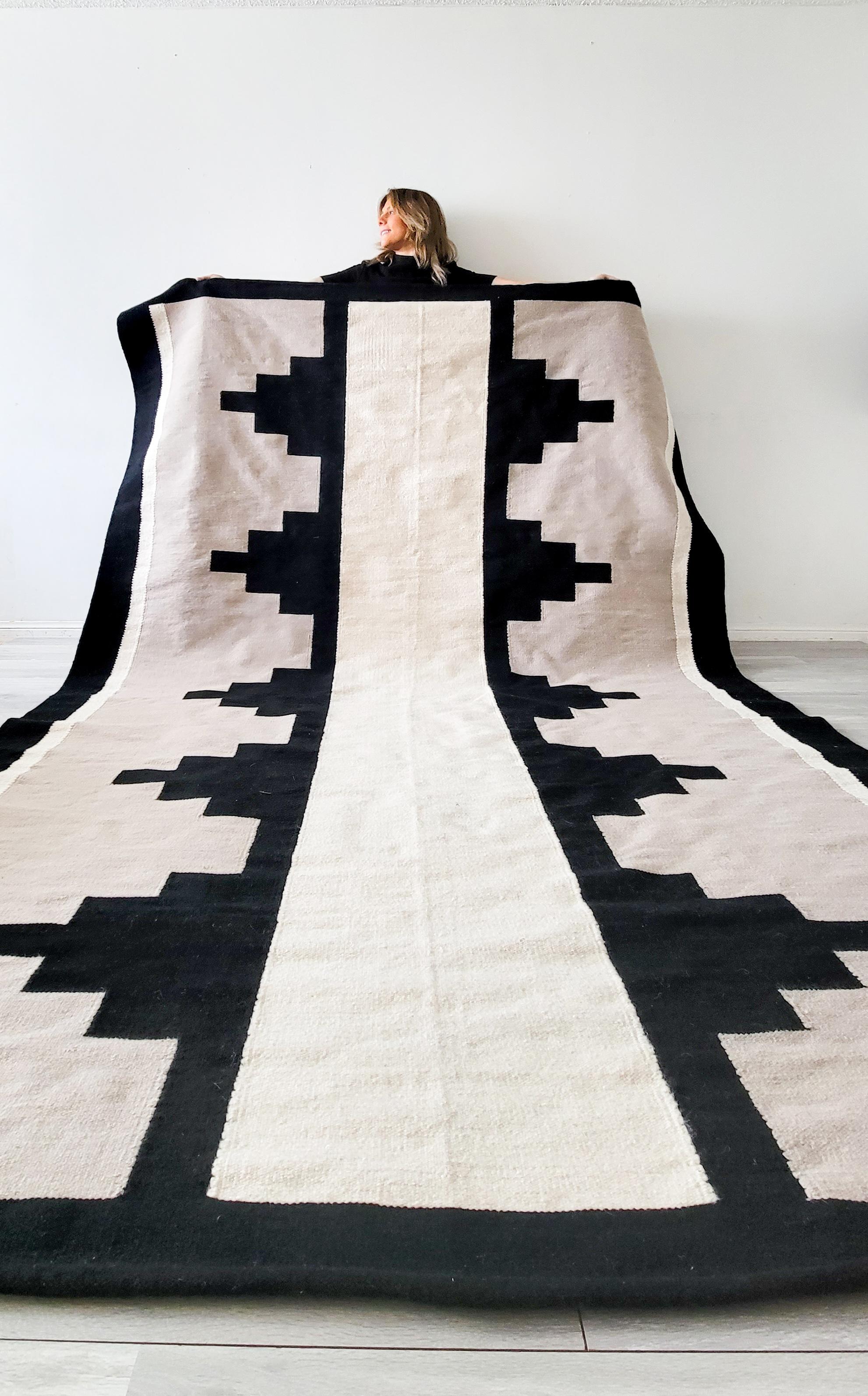 The combination of black and cream creates a bold statement and serves as a striking accent to any hallway and space

Product Description:
Made of natural wool 
Colours: Cream, Black
Designed in Canada 
Handmade in Egypt 
A pad is recommended to