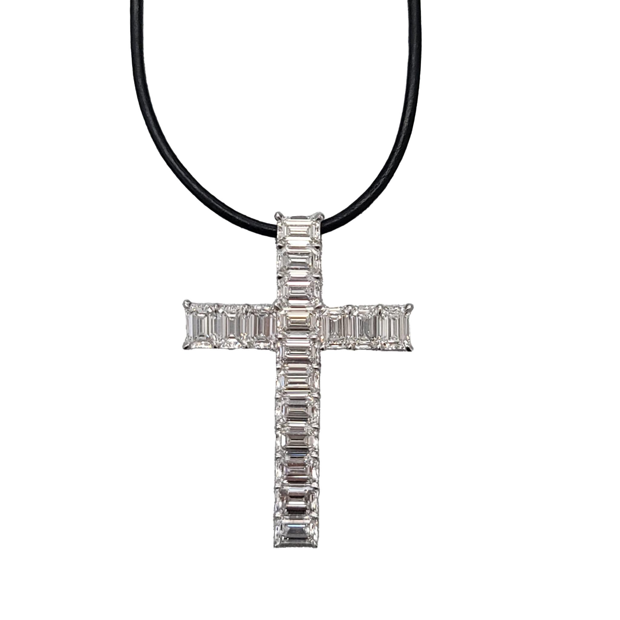  Diamond and Platinum Cross This diamond cross has 17 emerald cut diamonds weight 12.47 carats (Color: D-F,
Clarity: VVS1-VS2, GIA Certified) all set in platinum with adjustable leather cord. Measurements:
49mm x 34mm 