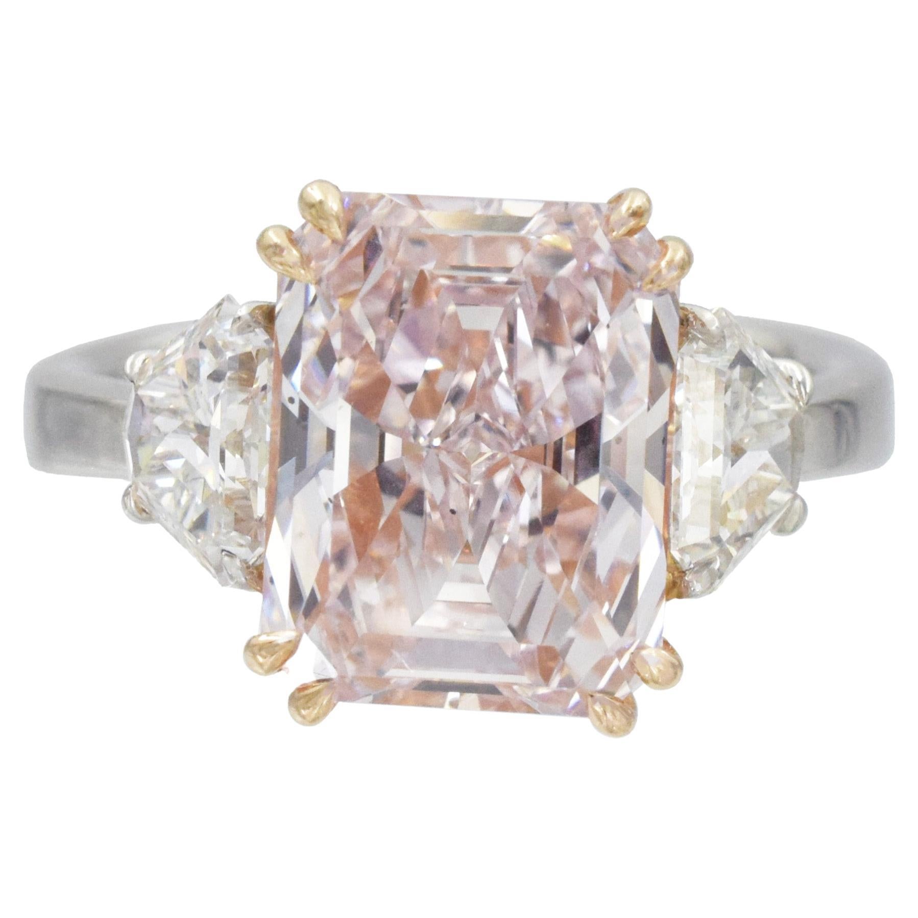  Natural GIA Certified Fancy Light Purplish Pink Diamond Ring 
This rectangular mixed cut diamond weighs 4.03 carat (Color: Fancy Light Purplish Pink, Clarity: SI1, GIA# ) set in 18k rose gold flanked by 2 kite shape diamonds weighing a total of