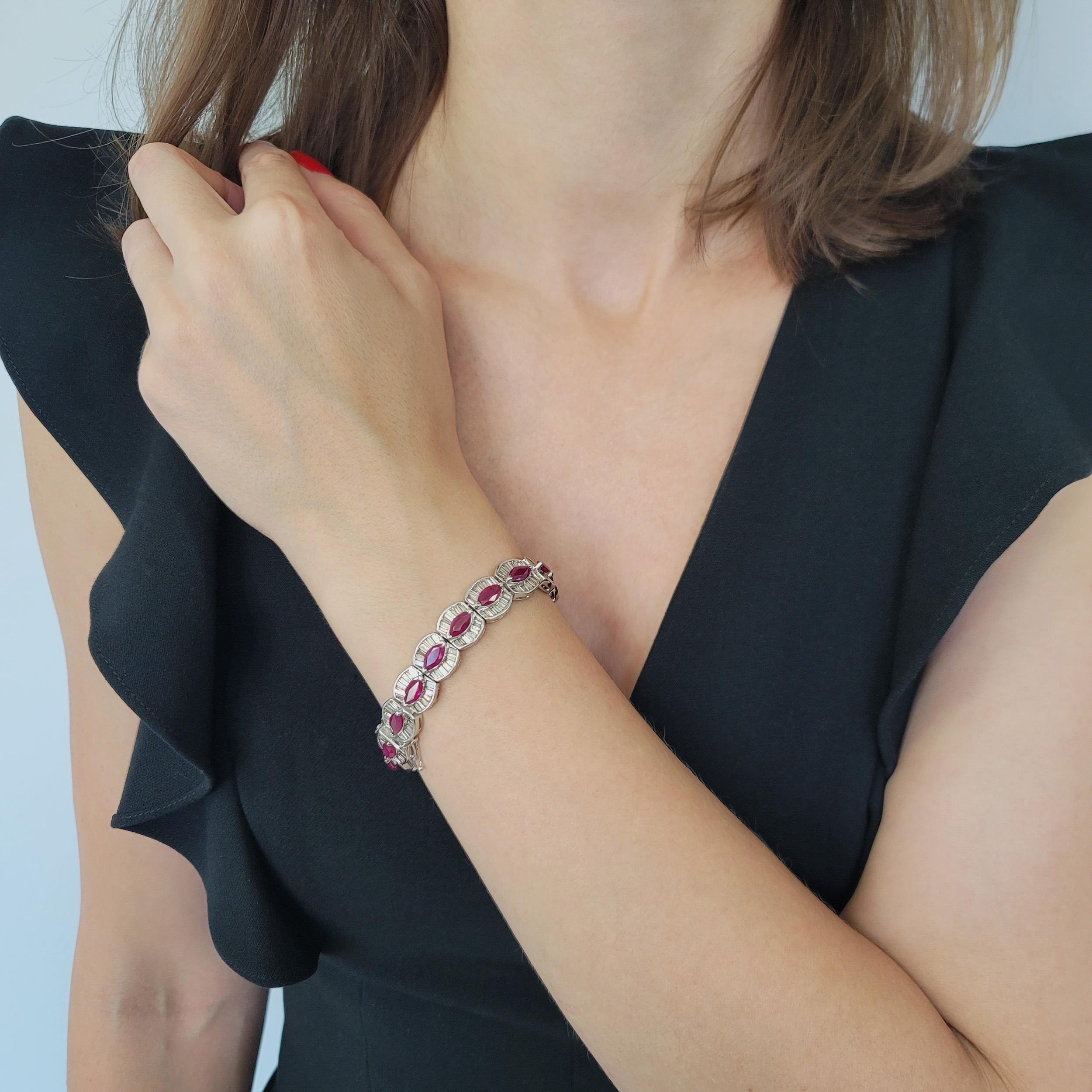 Ruby And Diamond Bracelet In 18k White consists of 17 rounded links, each featuring marquise cut ruby in the center, flanked by rows of channel set baguette cut diamonds. There is 17 marquise shape rubies with total weight of approximately
15.00ct;