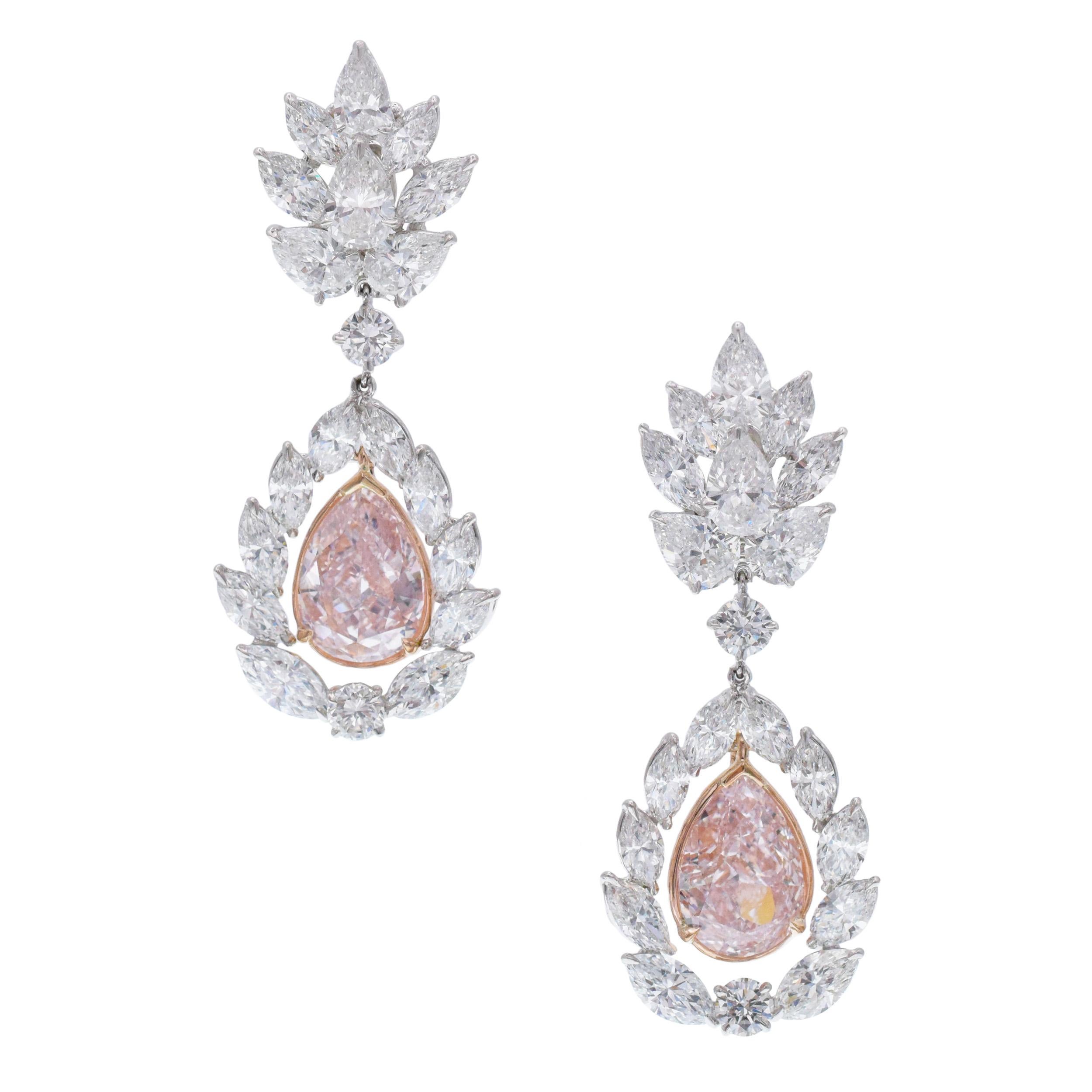 Unique pink diamond earrings!!!!!

Two pear-shaped pink diamonds surrounded by 28 marquise, 8 pear & 4 brilliant shape diamonds with the total weight of 11.75 carats set in platinum.

Pink diamond info:
3.59 carat pear shape natural light pink color