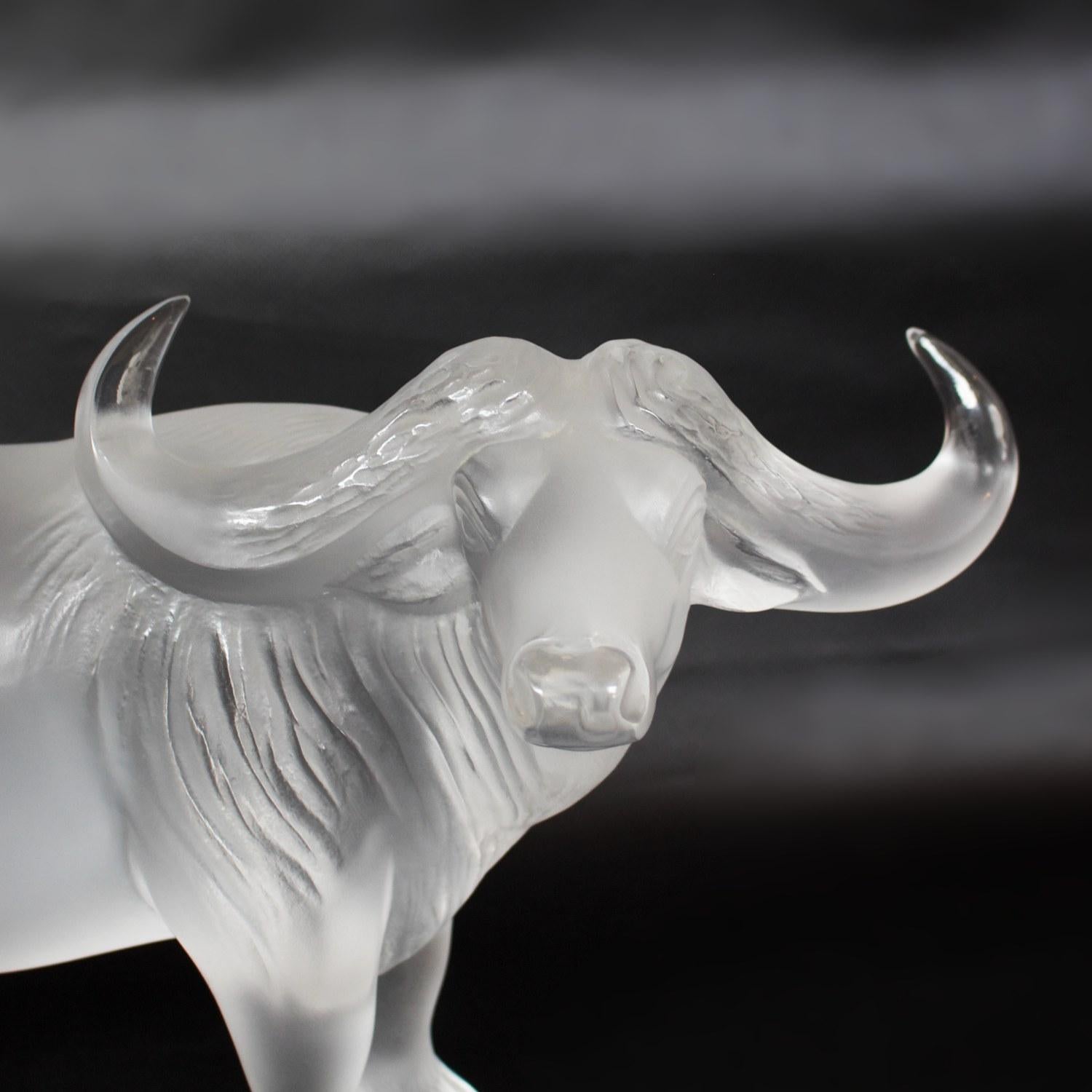 'Nam', a clear and frosted crystal glass water buffalo by Lalique.

Faintly etched 'Lalique France' to back of hoof.

Dimensions: H 11cm, W 38cm, D 9cm

Origin: French

Date: circa 1980

Item number: 907207.