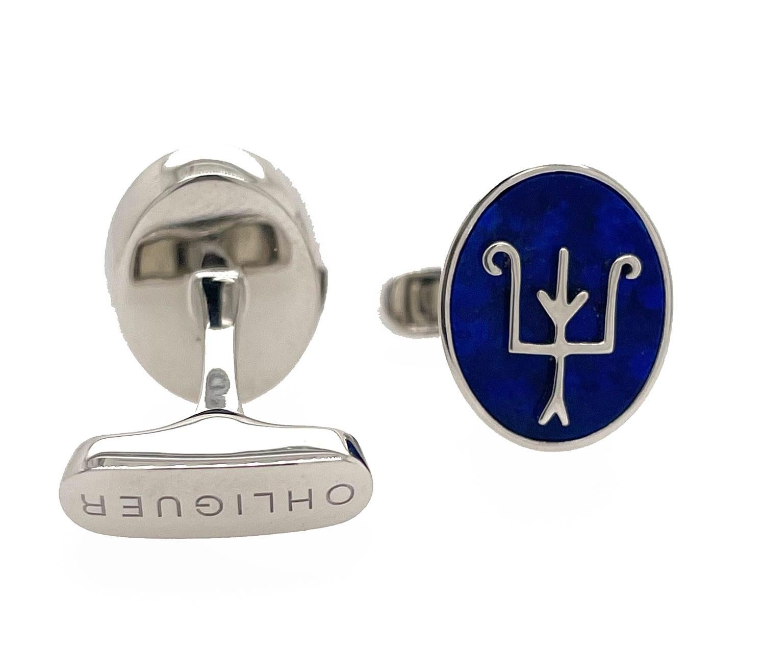 A pair of cufflinks set with bright blue lapis set in platinumthat is reminiscent of the glorious  jewels our grandmother wore to the formidable Shanghai parties of the 30s. Forged in 18ct gold, it bears our trademark double eagle, in an abstracted