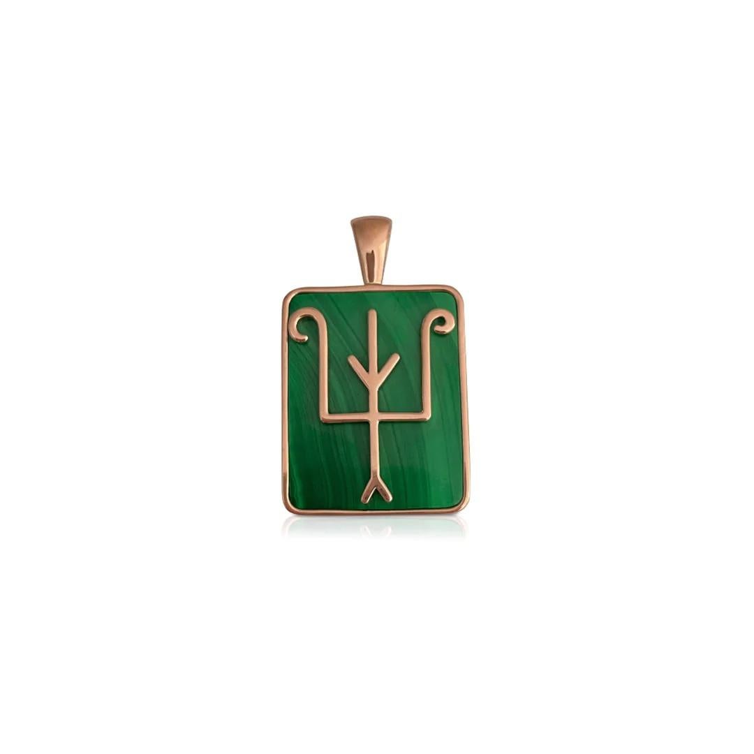 A bold pendant crafted with intense green malachite and forged in 18ct gold, it bears our trademark double eagle, in an abstracted form as homage to our past. 
18ct Rose, White or Yellow gold 
Natural Malachite inlay
Ethically sourced gold 

Comes