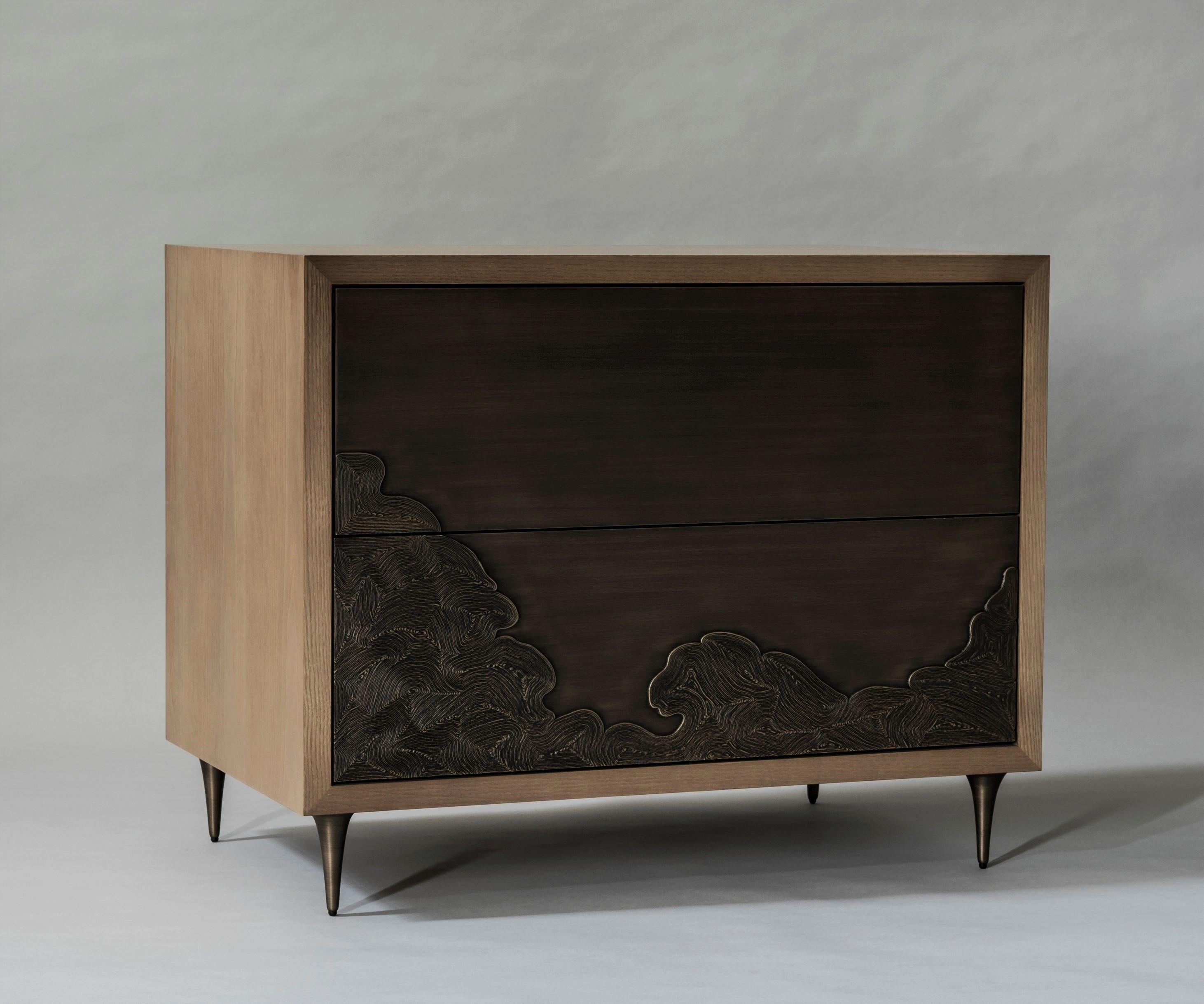 Named after the Japanese word for wave, the Nami Collection showcases bronzework in the form of swelling surf. The bedside table’s richly textured, push-to-open drawer fronts were cast using coiled thread - a nod to the ancient Dhokra creations of