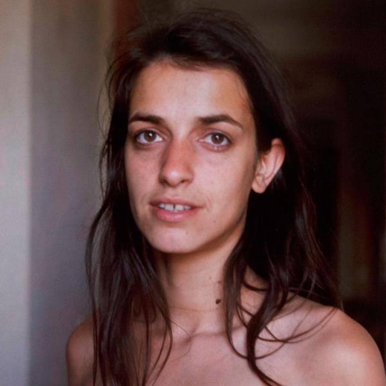 Nan Goldin (b. 1953) began her career in the 1970's, as she took candid shots of her lovers and friends.

In the 1980's she further documented her social circle, characters often living on the margins of society, in New York City and beyond. Many of