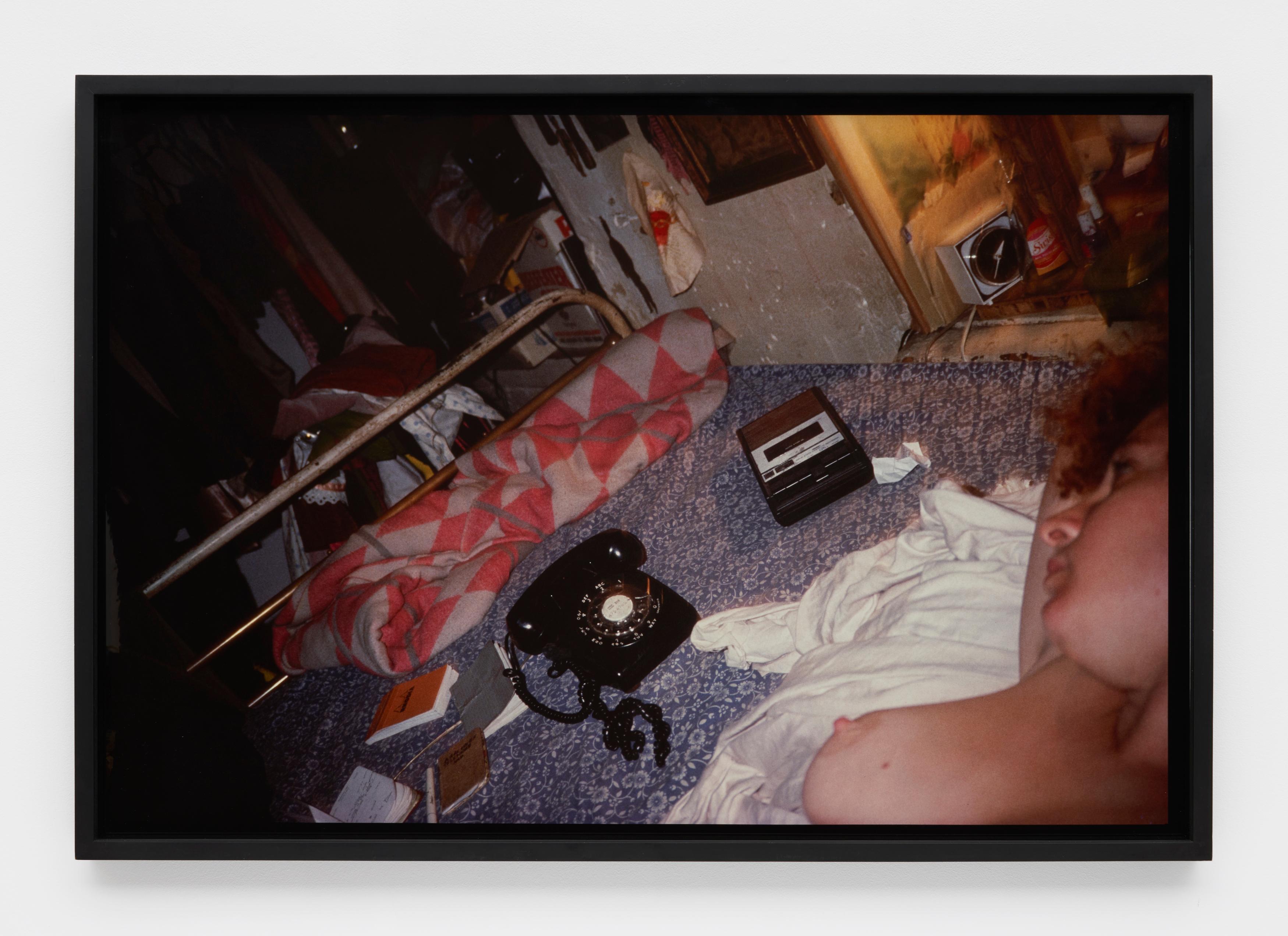 Self-portrait in bed, NYC - Photograph by Nan Goldin