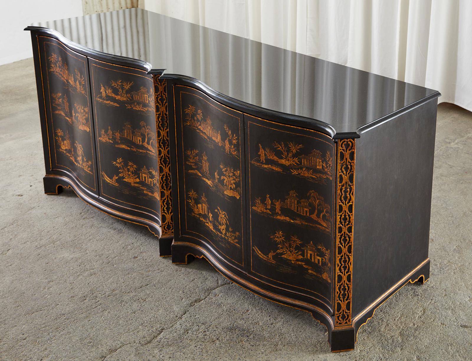 Spectacular large sideboard chest, buffet, or credenza featuring hand painted parcel gilt chinoiserie reserves by Nancy Corzine. The bespoke cabinet has a serpentine front with four large doors separated by columns of Chinese Chippendale style