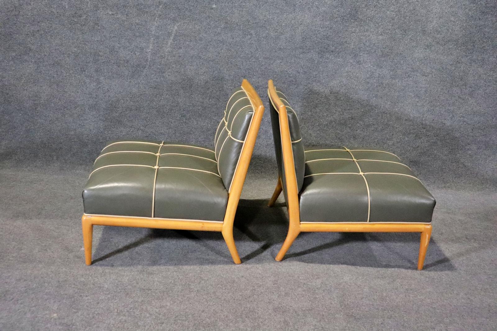 Mid-century modern style slipper chairs by Nancy Corzine. Tufted leather in blonde wood frame.
Please confirm location NY or NJ