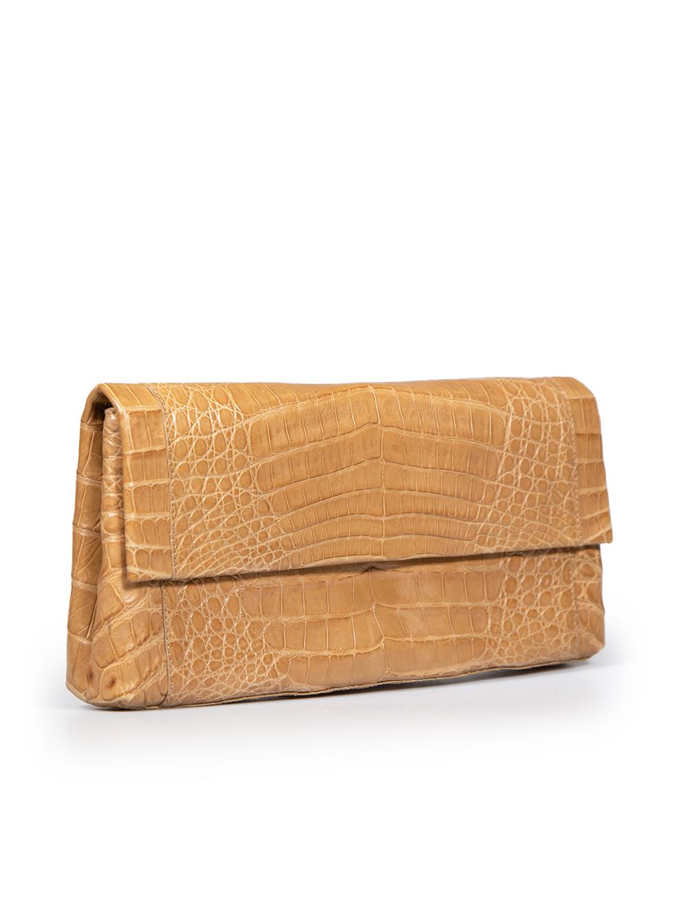 CONDITION is Verygood. Minimal wear to the clutch is evident. Light discolouration to the bottom four corners on this used Nancy Gonzalez designer resale item.
 
 
 
 Details
 
 
 Brown
 
 Crocodile leather
 
 Mini clutch bag
 
 Flap with magnetic