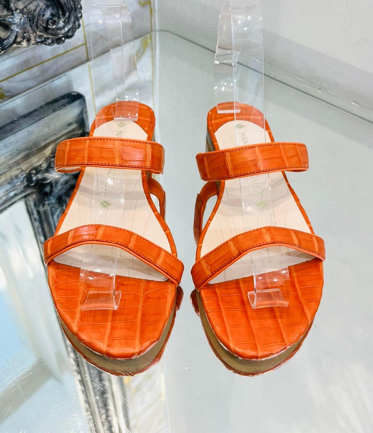 Nancy Gonzalez Crocodile Skin Sandals

Orange 'Frida' crafted crafted in Italy from crocodile skin.

Designed with two straps, open toe and slip-on style. Rrp £630

Size – 36

Condition – Very Good

Composition – Crocodile Skin

Comes with – Shoes