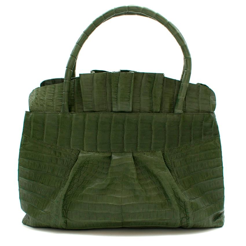 Nancy Gonzalez Green Crocodile Tote Bag

- top handles and removable shoulder strap - pleated frilled trim - multiple compartments inside - suede lining 

- small mark on the side from storage (please see image 3)

Approx in CM

Height - 30cm
Width