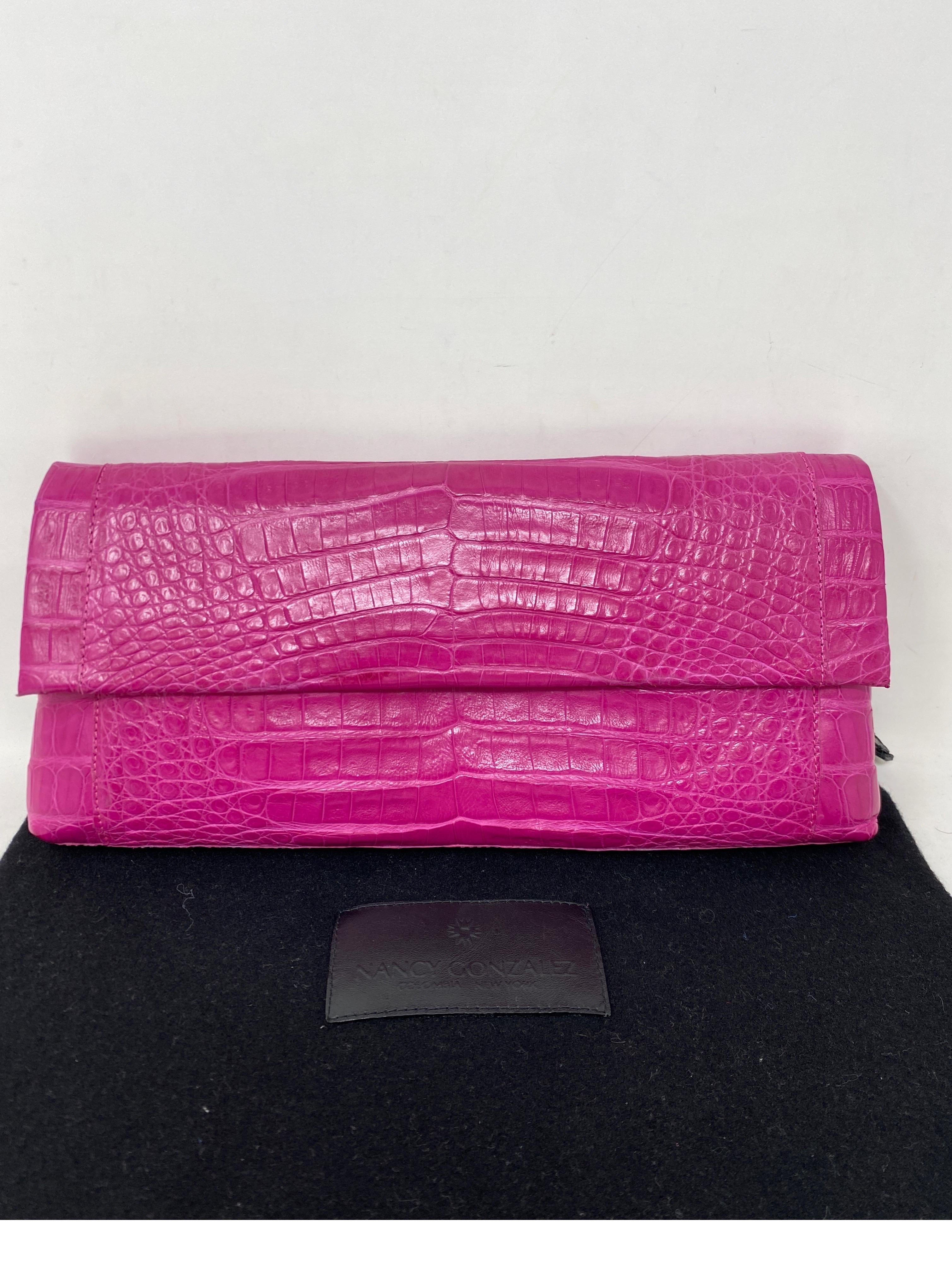 Nancy Gonzalez Hot Pink Crocodile Clutch. Mint condition. Beautiful color bag. Interior clean. Never worn. Comes with tags and dust bag. Guaranteed authentic. 