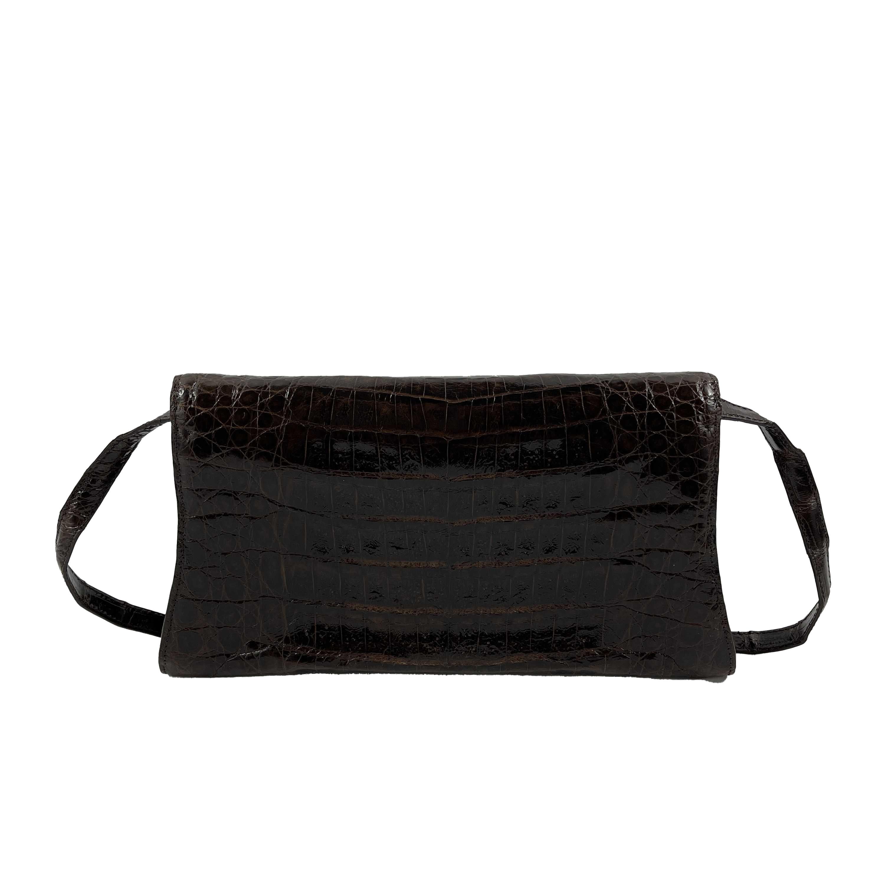 Nancy Gonzalez - Pristine - Small Crocodile Trapezoid Clutch Envelope - Brown - Handbag

Description

This handbag by Nancy Gonzalez is crafted with brown crocodile skin on the exterior and strap.
It features an envelope style flap that opens using