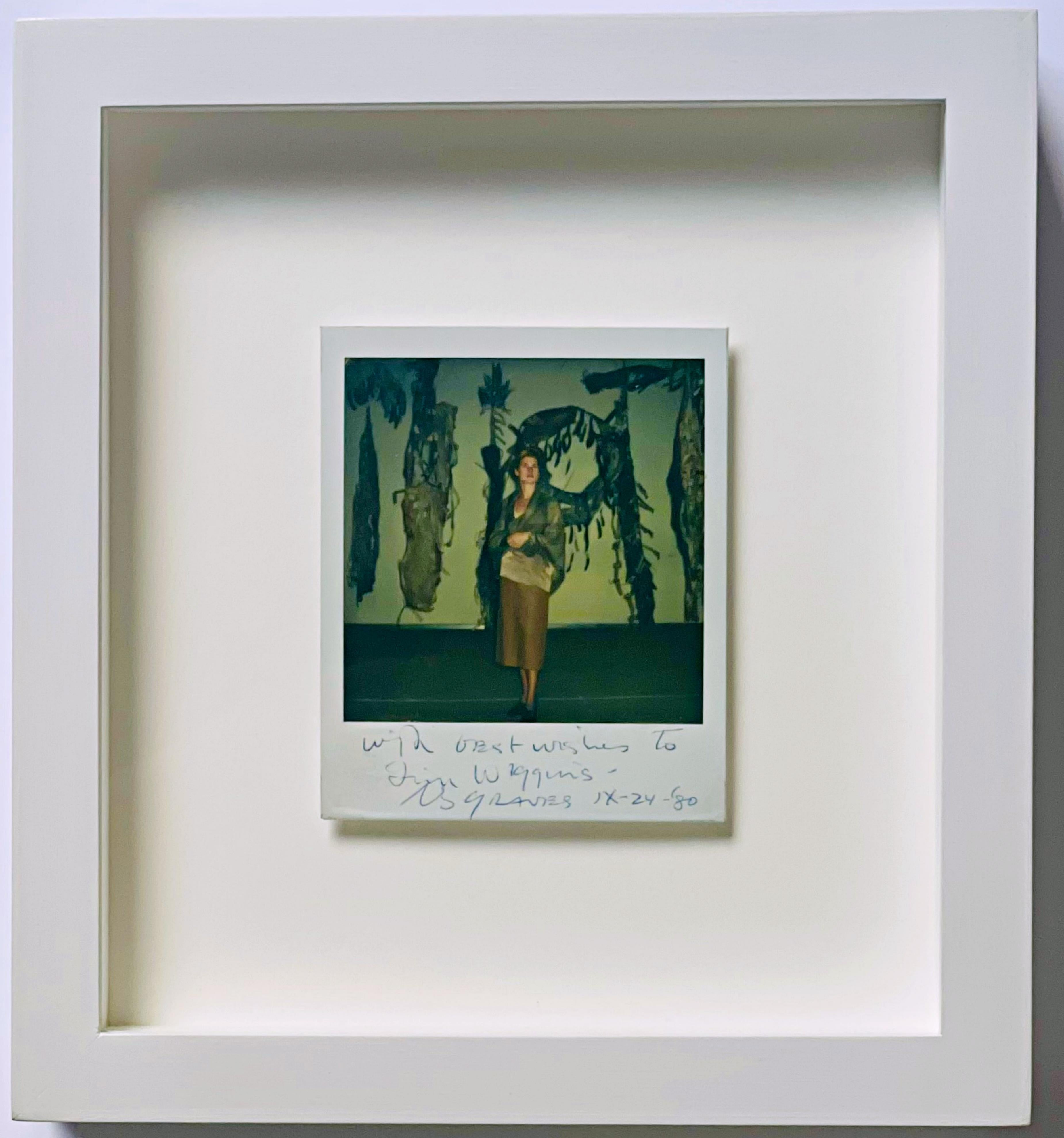 Hand signed, dated and inscribed Polaroid photograph of Nancy Graves, dated September 24, 1980, depicting the artist with her iconic sculpture Shaman.
Provenance: Collection of Jim Wiggins, one of the last century
s foremost autograph