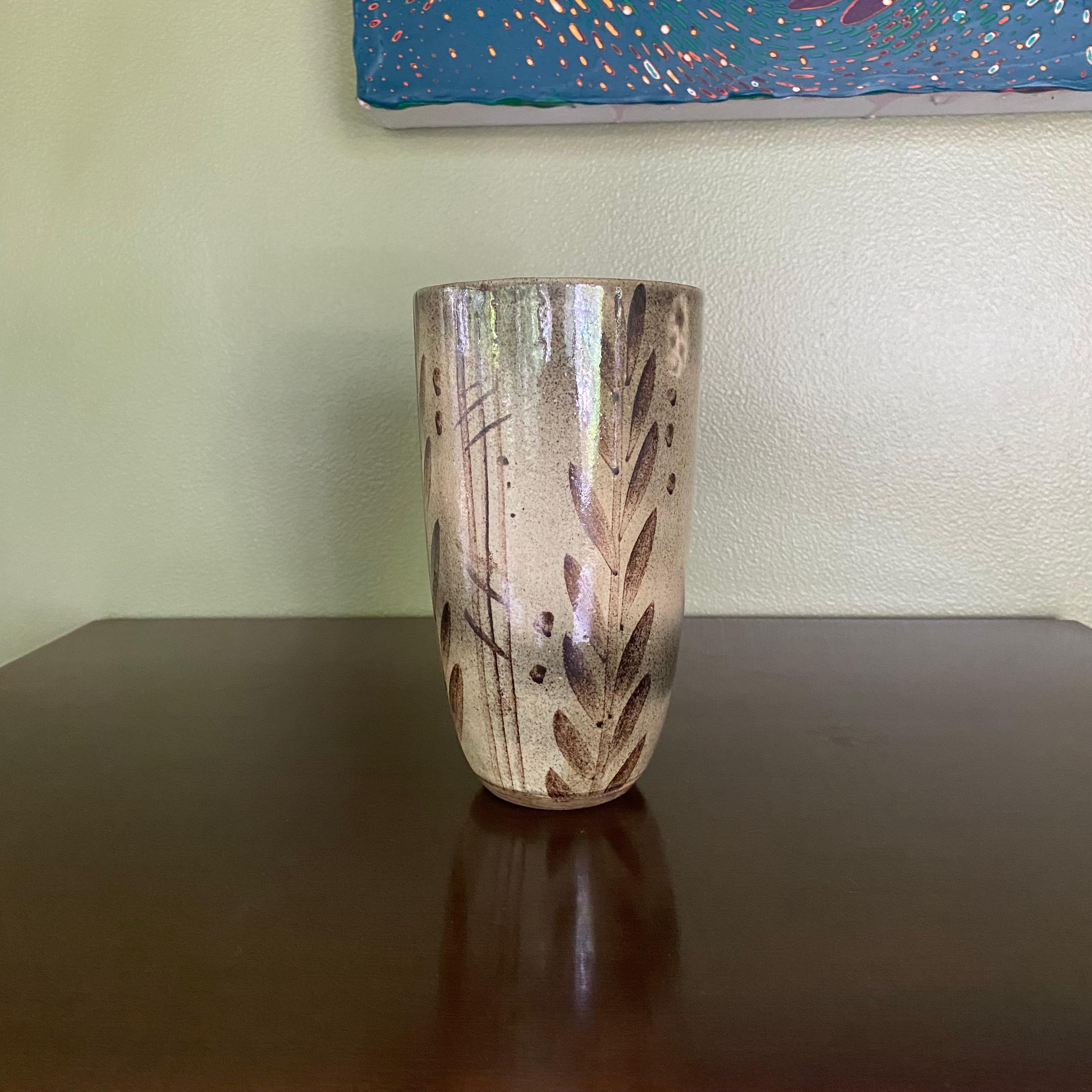 This is a beautiful studio craft, handmade signed vase, ca. 1950's, signed Wickham for Nancy Wickham. It's a beautiful example of a period vase.

From Furniture Forum 1, ca. 1949: NANCY WICKHAM(b. 1923), feels that 