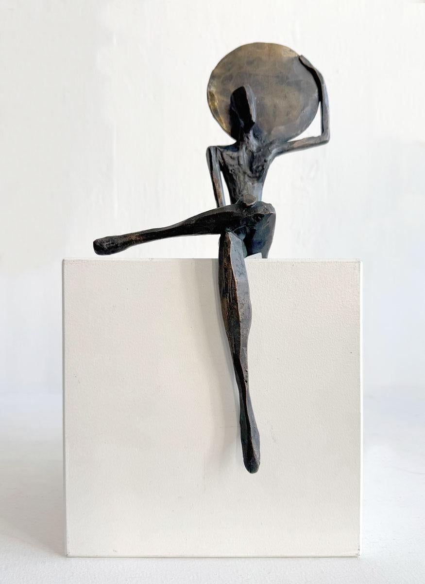 Apollon III. By Nando Kallweit. Elegant bronze sculpture of man with a disc