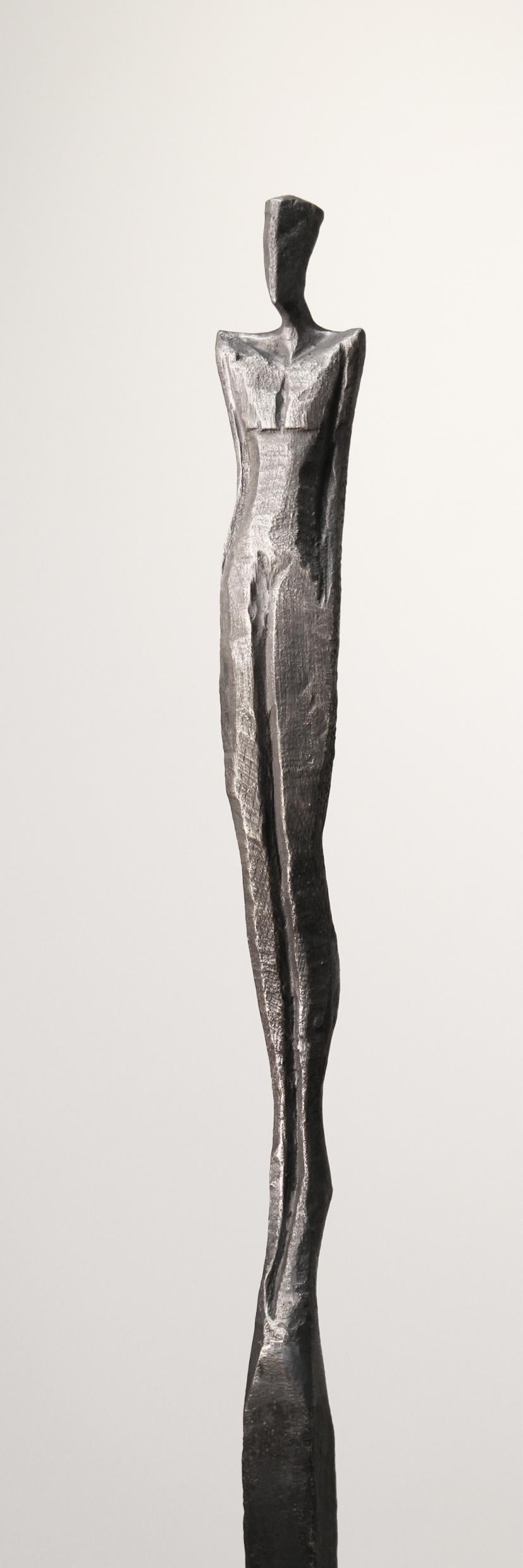 Edward III is a tall, elegant bronze sculpture of a human figure.  

Nando Kallweit is a German sculptor working in bronze and oak.  Kallweit carves the original piece from a piece of oak using a chainsaw.  The oak marque is then used to create a