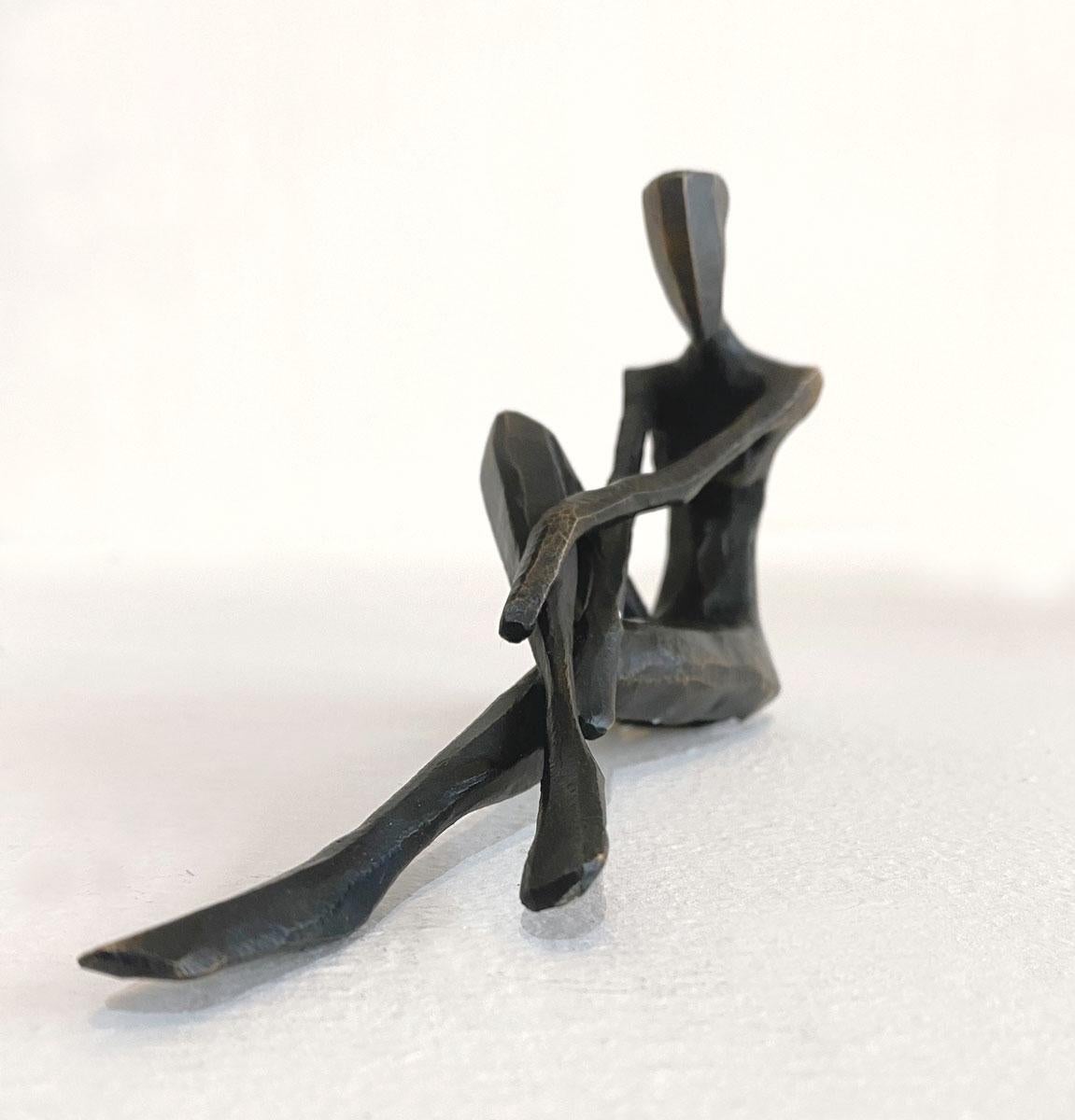 Eliza is a figurative bronze sculpture in a relaxed pose by Nando Kallweit.

Modelled on modern youthful postures but with a nod to the importance of heritage through the stylised Egyptian-influenced head. A lovely piece on its own or with a group