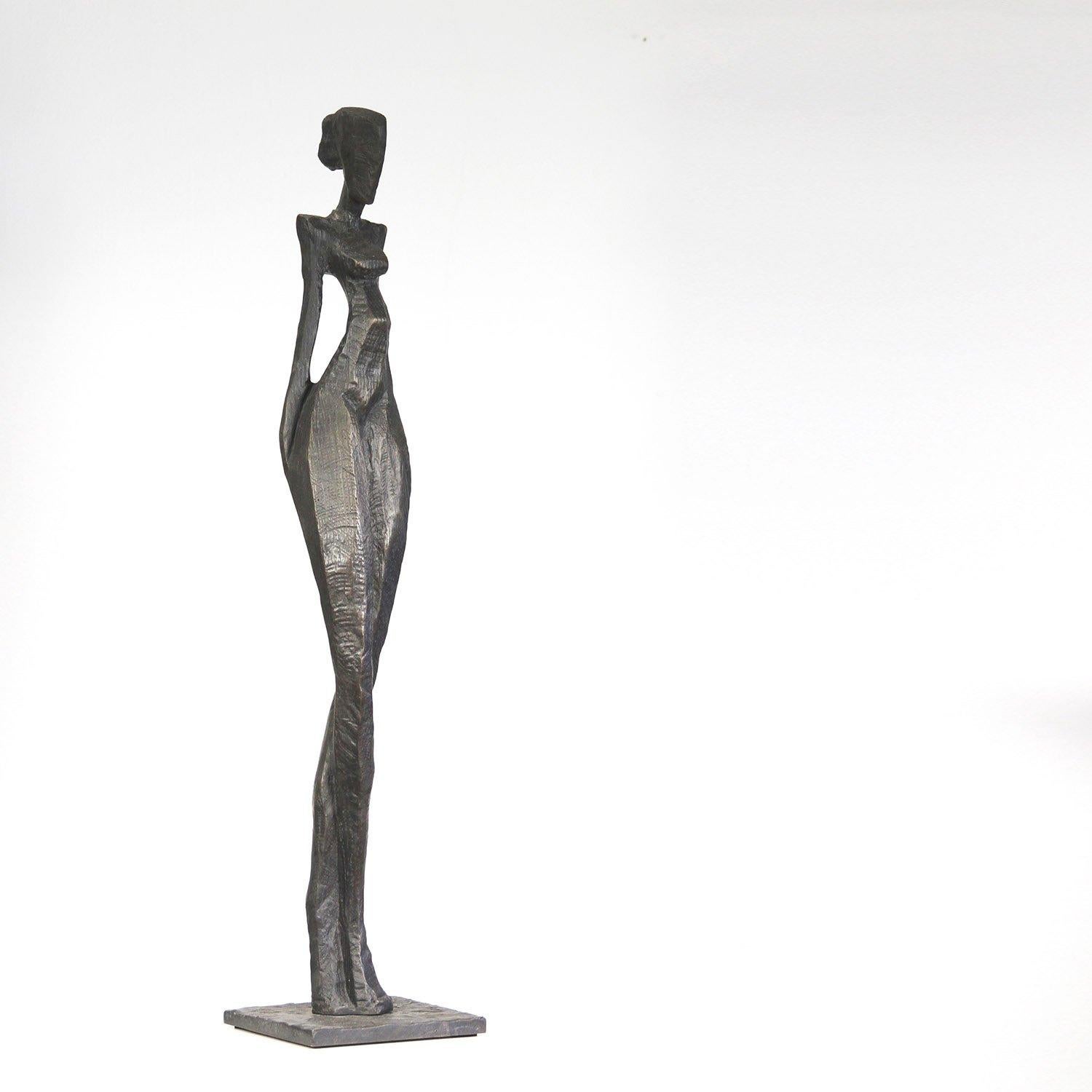 Evi is an elegant figurative bronze sculpture by Nando Kallweit.

Nando carved the marque for the body from a piece of oak using a small chain saw. The marque is then used to make the cavity for a sand and clay cast bronze. The figure therefore