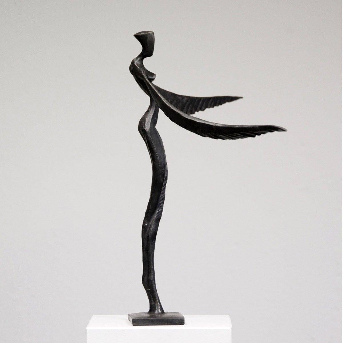 Fae – Victoria is an elegant figurative bronze sculpture by Nando Kallweit.

Inspired by the the legend of the phoenix, this female figure has graceful wings instead of arms.  The piece, and its dual name, alludes to the strength and rebirth that is