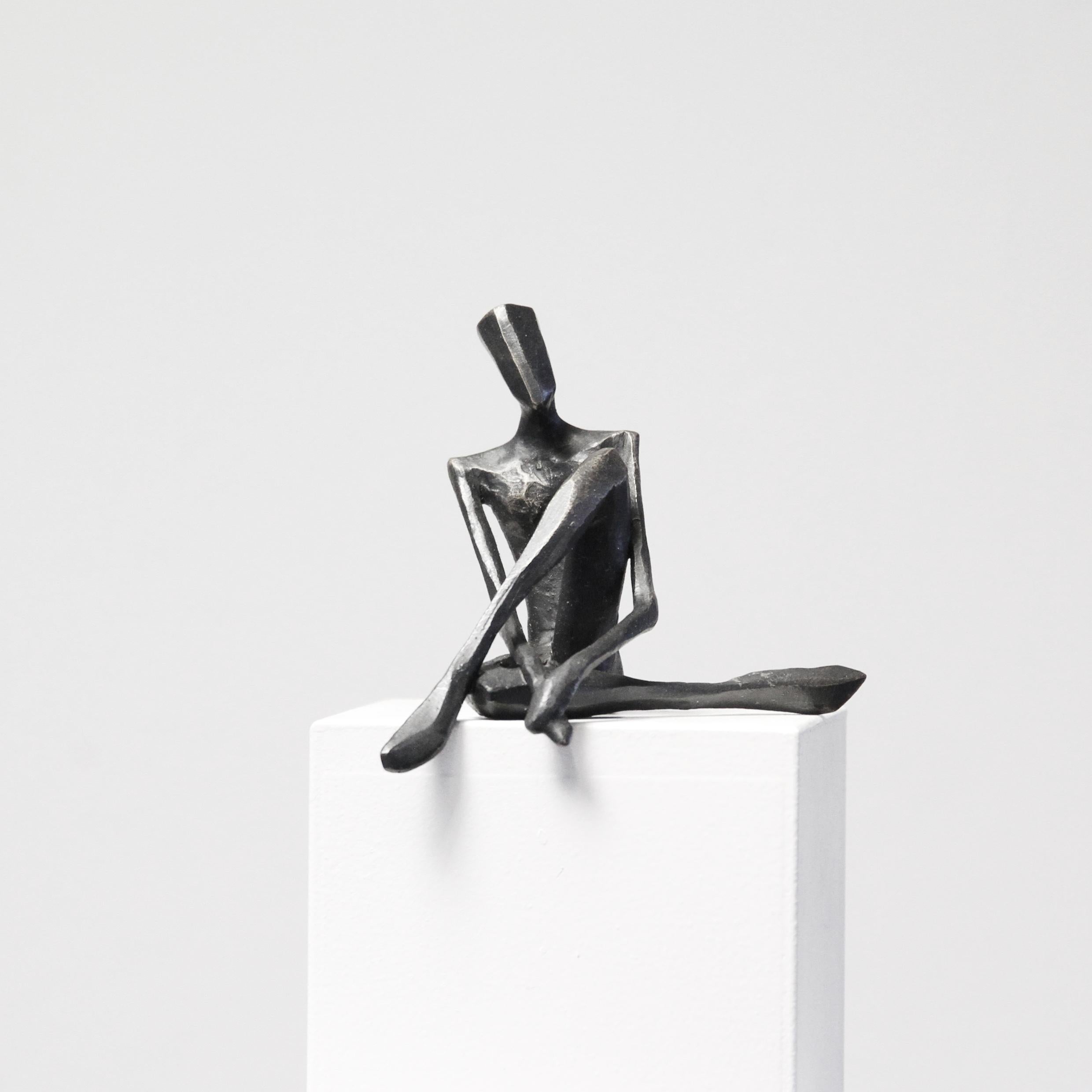 John is a figurative bronze sculpture in a relaxed pose by Nando Kallweit.

Modelled on modern youthful postures but with a nod to the importance of heritage through the stylised Egyptian-influenced head. A lovely piece on its own or with a group of