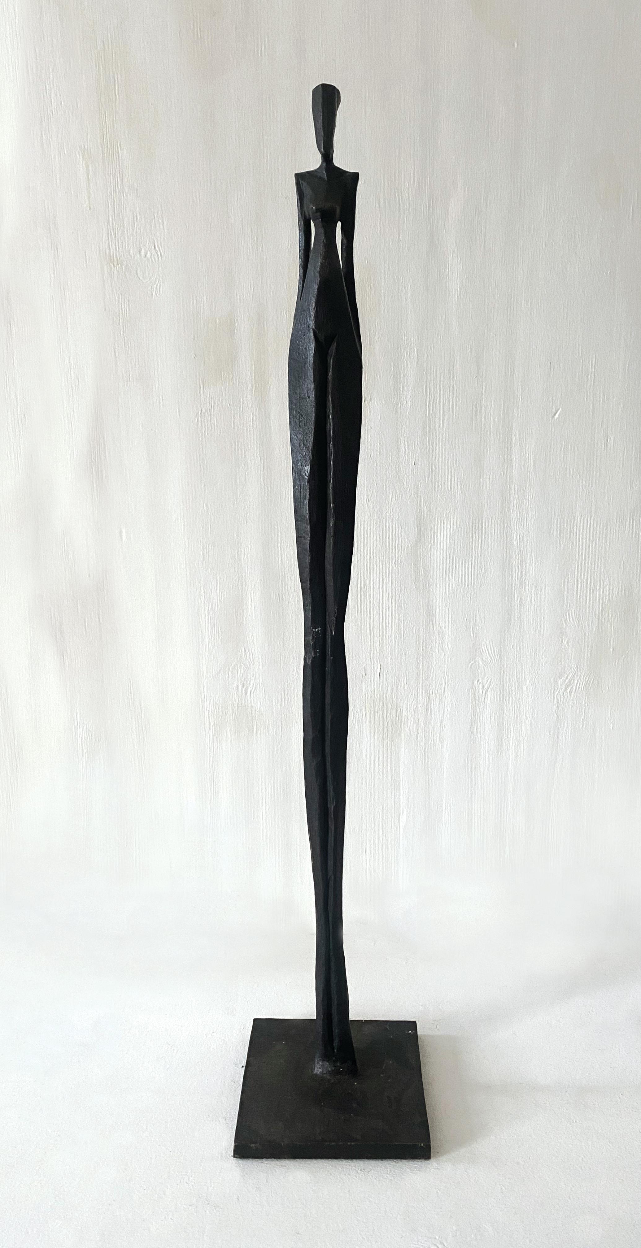 Kathy by Nando Kallweit. Tall, elegant bronze sculpture of human figure. 1