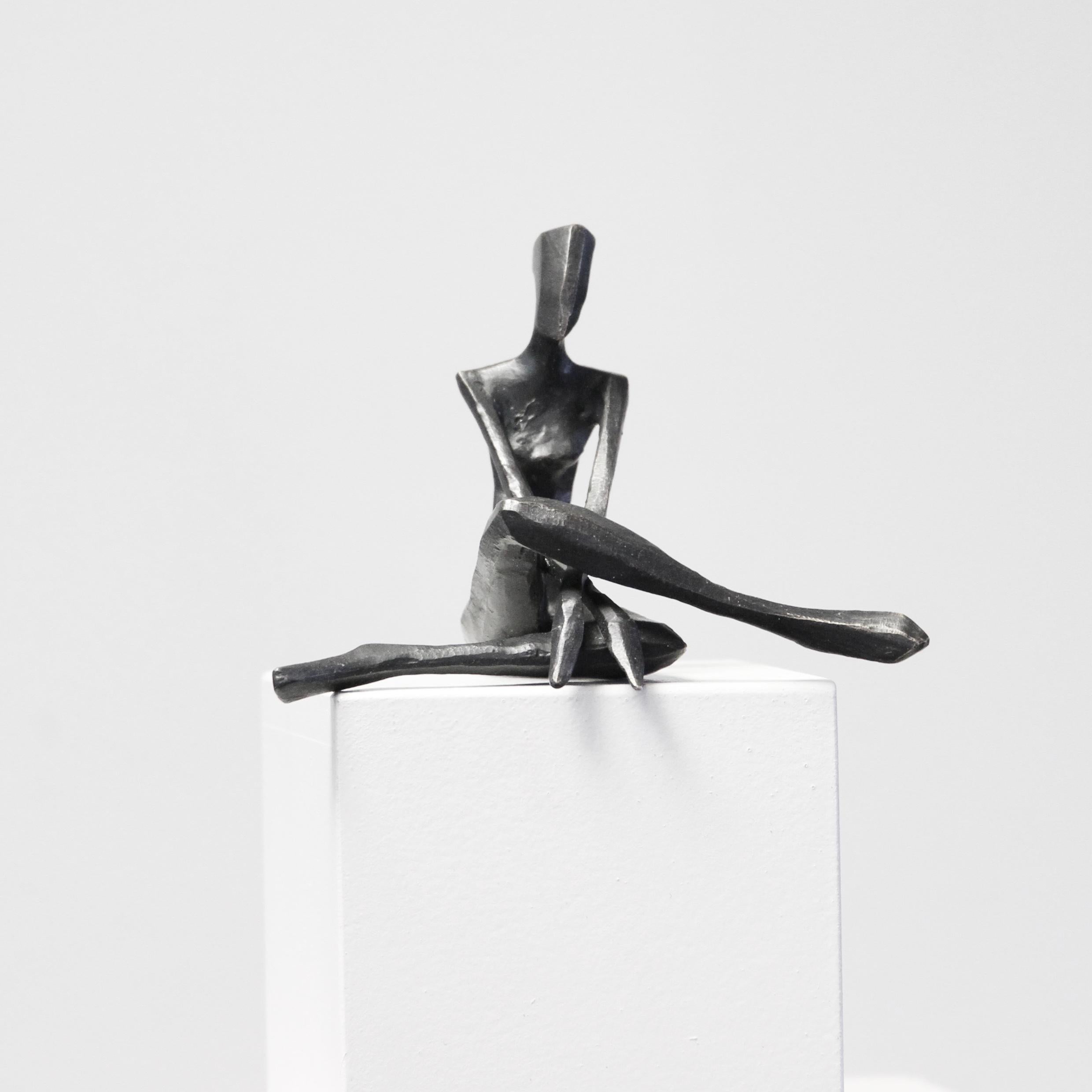 Ruby is a figurative bronze sculpture in a relaxed pose by Nando Kallweit.

Modelled on modern youthful postures but with a nod to the importance of heritage through the stylised Egyptian-influenced head. A lovely piece on its own or with a group of