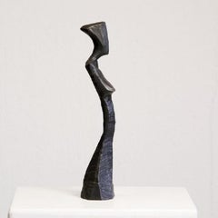 Torso of Donna by Nando Kallweit.  Bronze sculpture of the torso of a woman.