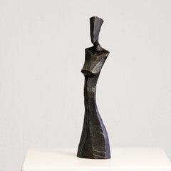 Torso of Donna by Nando Kallweit.  Bronze sculpture of the torso of a woman.