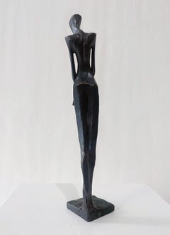 Woman with Book by Nando Kallweit.  Elegant figurative sculpture.