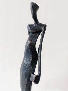 Woman with Dice by Nando Kallweit. Elegant figurative sculpture.