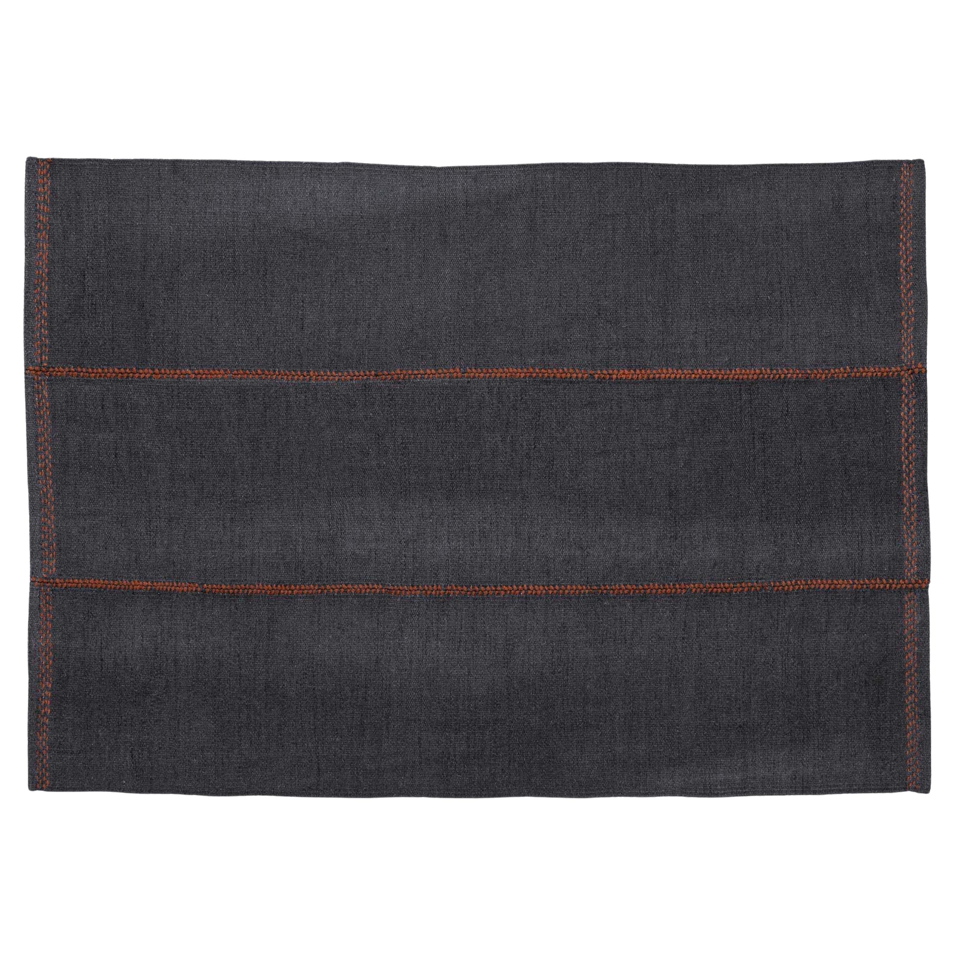 Nani Marquina Mía Rug in
Navy
with Dashed Stitching in Red 170x240 cm