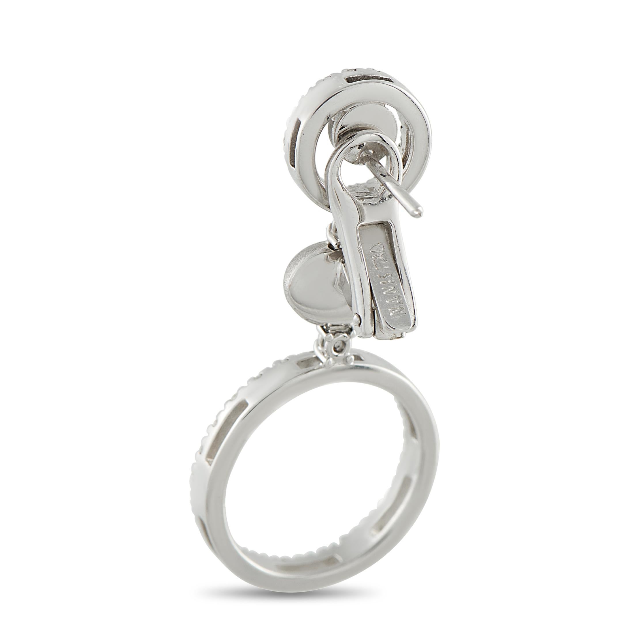 These Nanis earrings are designed to add sparkle to every movement. Diamonds with a total weight of 1.20 carats elevate the circular 18K White Gold settings. Each earring measures 1.50 long by 0.69 wide.This jewelry piece is offered in estate