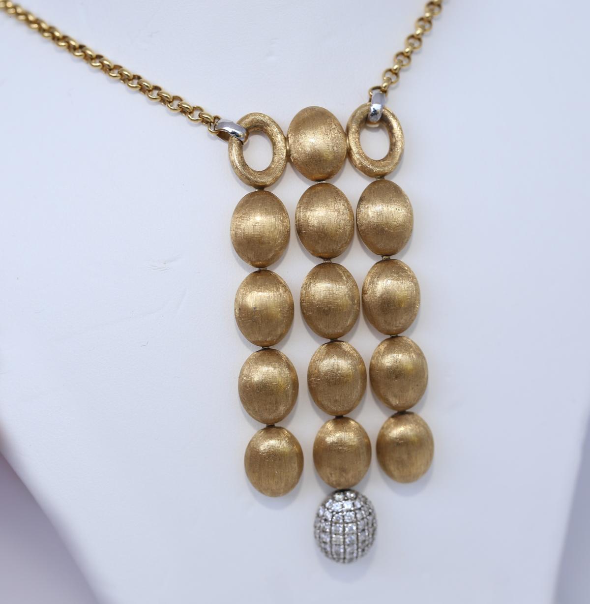 Nanis Dancing In The Rain Pendant. Wonderful design and perfect execution. 
This gorgeous Nanis pendant necklace is handcrafted beautifully in 18K yellow Gold with a sleek finish and a chandelier-style pendant.  The boules look smooth and sleek and