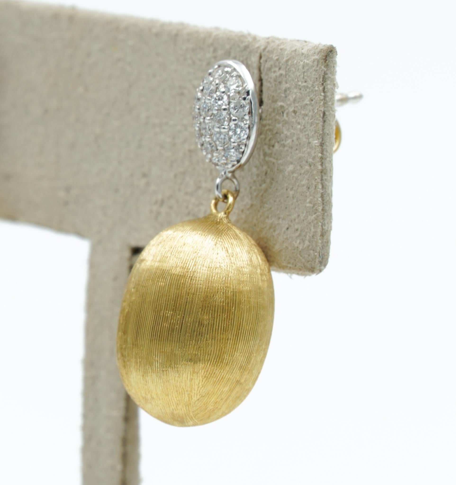 These Nanis Dancing in the Rain Earrings play with light and elegant diamond details. It was handcrafted beautifully and includes the signature brushed finish and hand-engraved with artisanal wisdom. The earrings start with a pave stud that has a