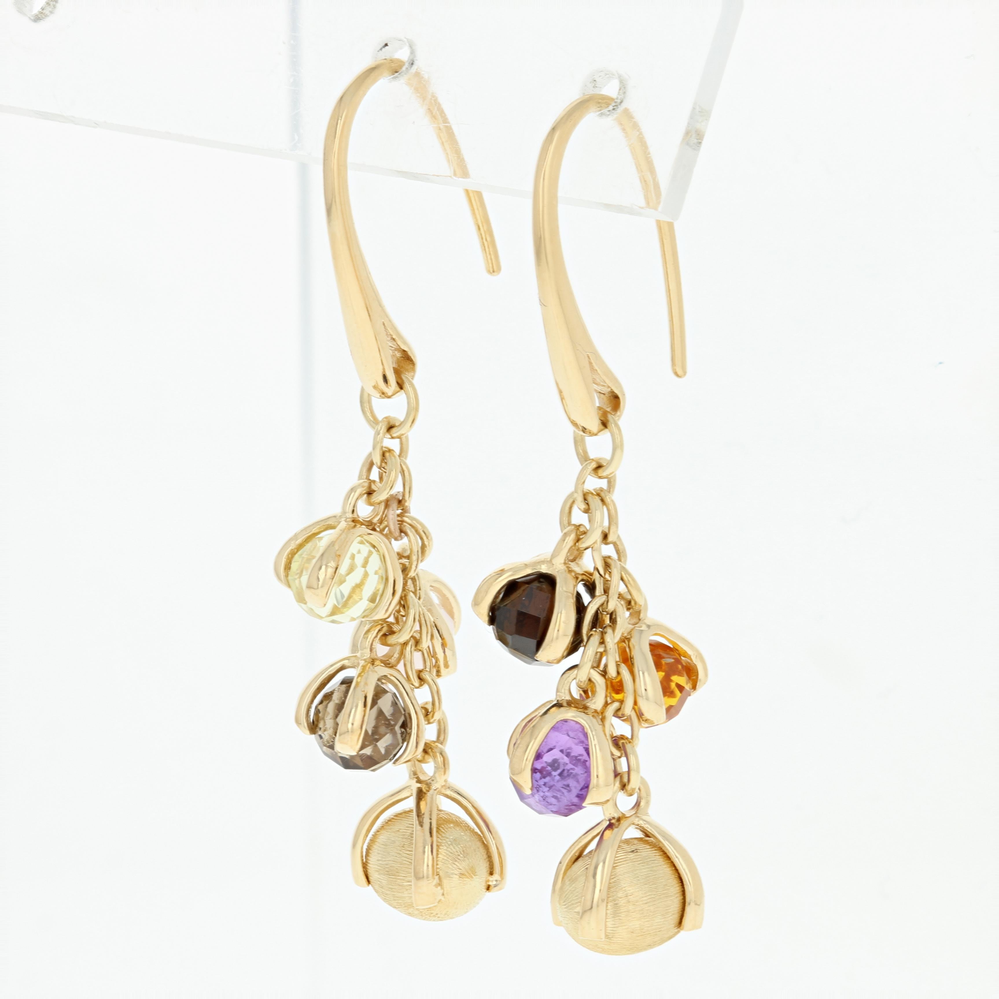 Flirty and playful, these beautiful Nanis earrings will be a delightful addition to your jewelry collection! This 18k yellow gold pair of Italian-made dangles feature glistening gemstone baubles and textured gold drops suspended along cable chain
