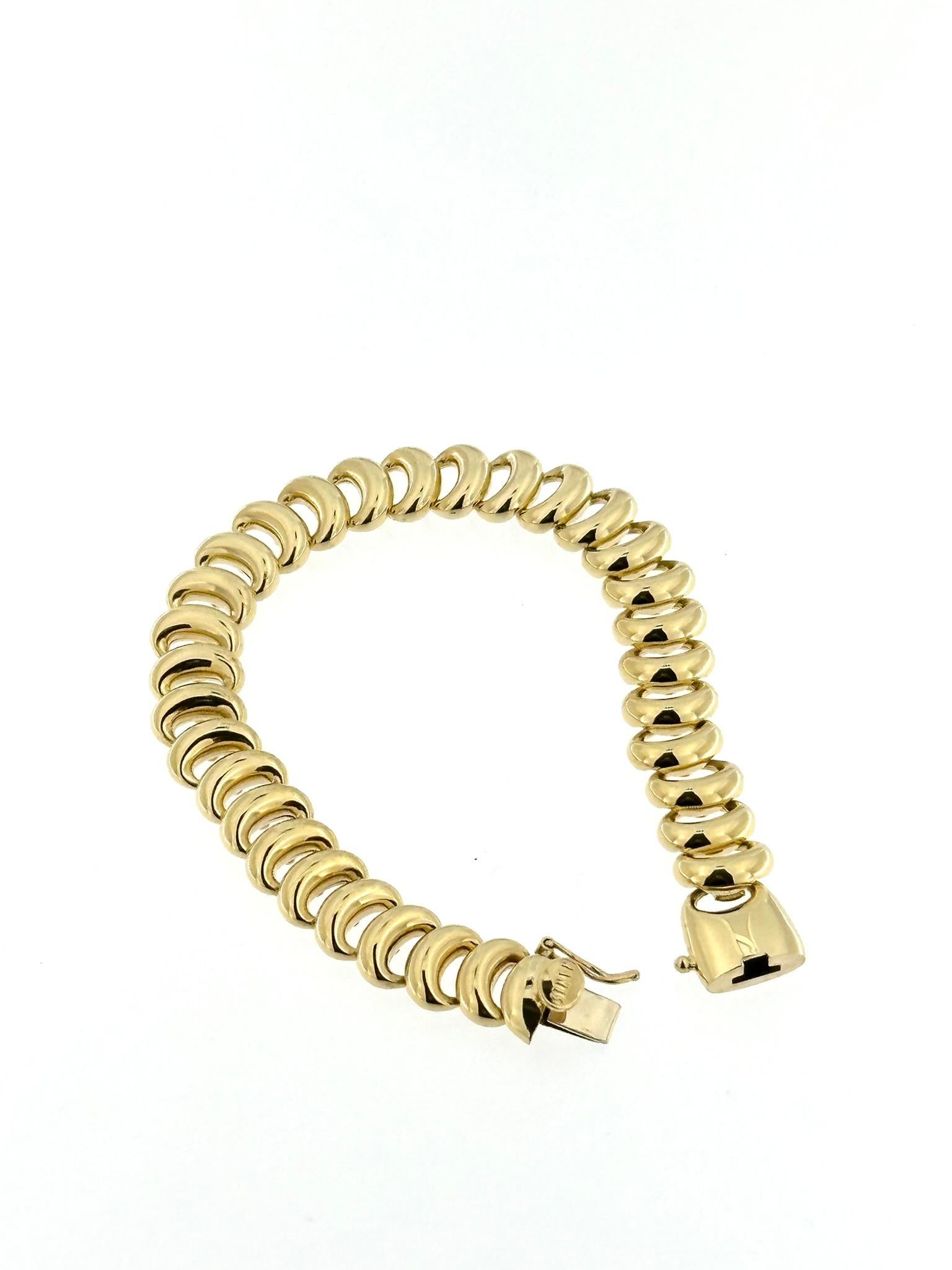 The Nanis Yellow Gold Flexible Bracelet is a luxurious and elegant piece of jewelry crafted by Nanis, an esteemed Italian goldsmith renowned for their exquisite designs and craftsmanship. This bracelet is made from 18-karat yellow gold, signifying a