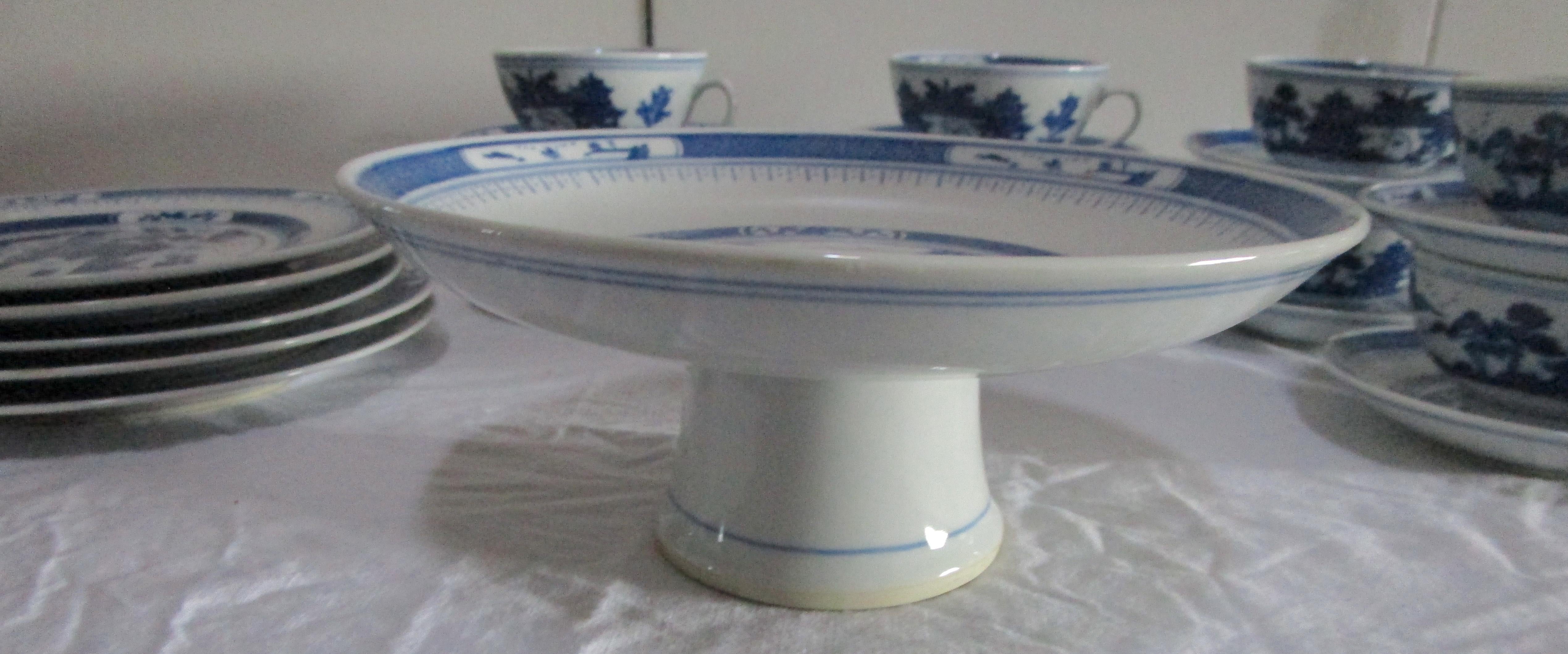 Dessert will appear extra delicious on this set of Nanking blue and white porcelain Chinese export assembled set with teapot and cups circa 1940. There is a wonderful mix of pieces for presentation: a raised circular pedestal plate ( 9 inches wide),
