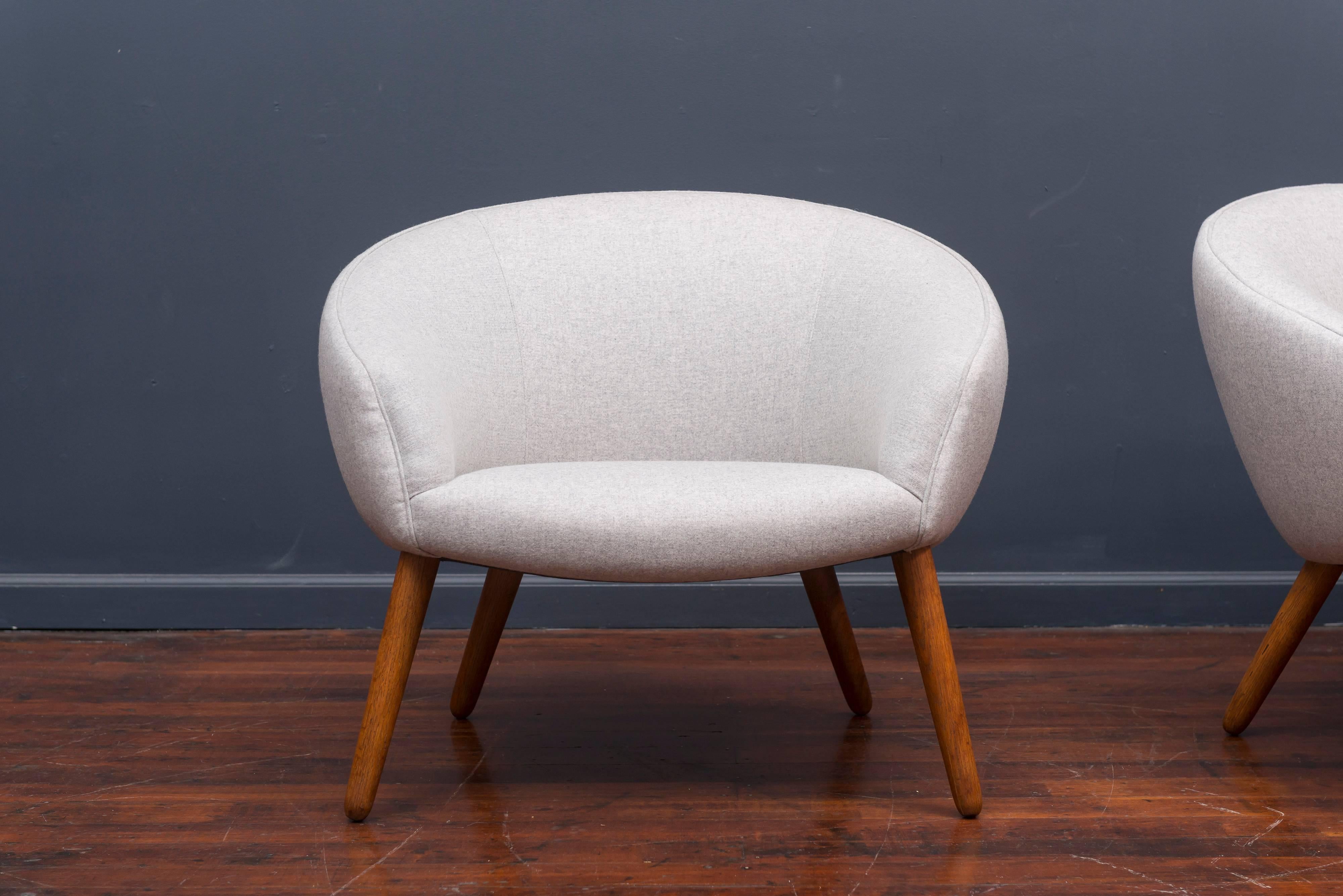 Nanna Ditzel model AP 26 lounge chairs made by AP Stolen, Denmark. Newly upholstered with oak legs, very comfy.