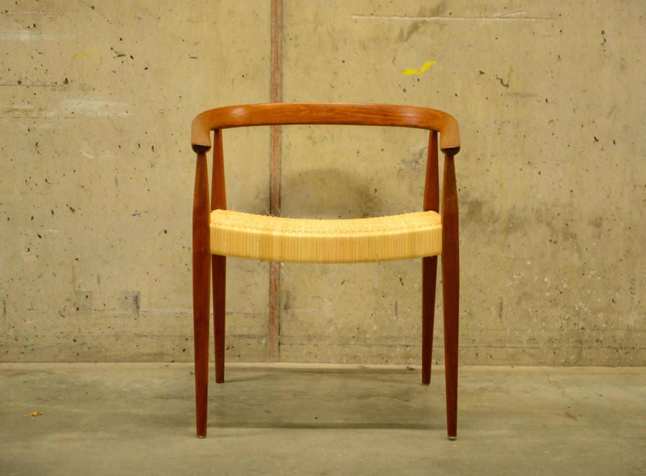 Armchair model 113 in teak and rattan / cane by Danish designer Nanna Ditzel. Produced in Denmark by Poul Kolds Savværk. Rare to find this model in teak. The rattan/cane seat is brand new and was done by the Danish company Bruun Olsen Flet. As with