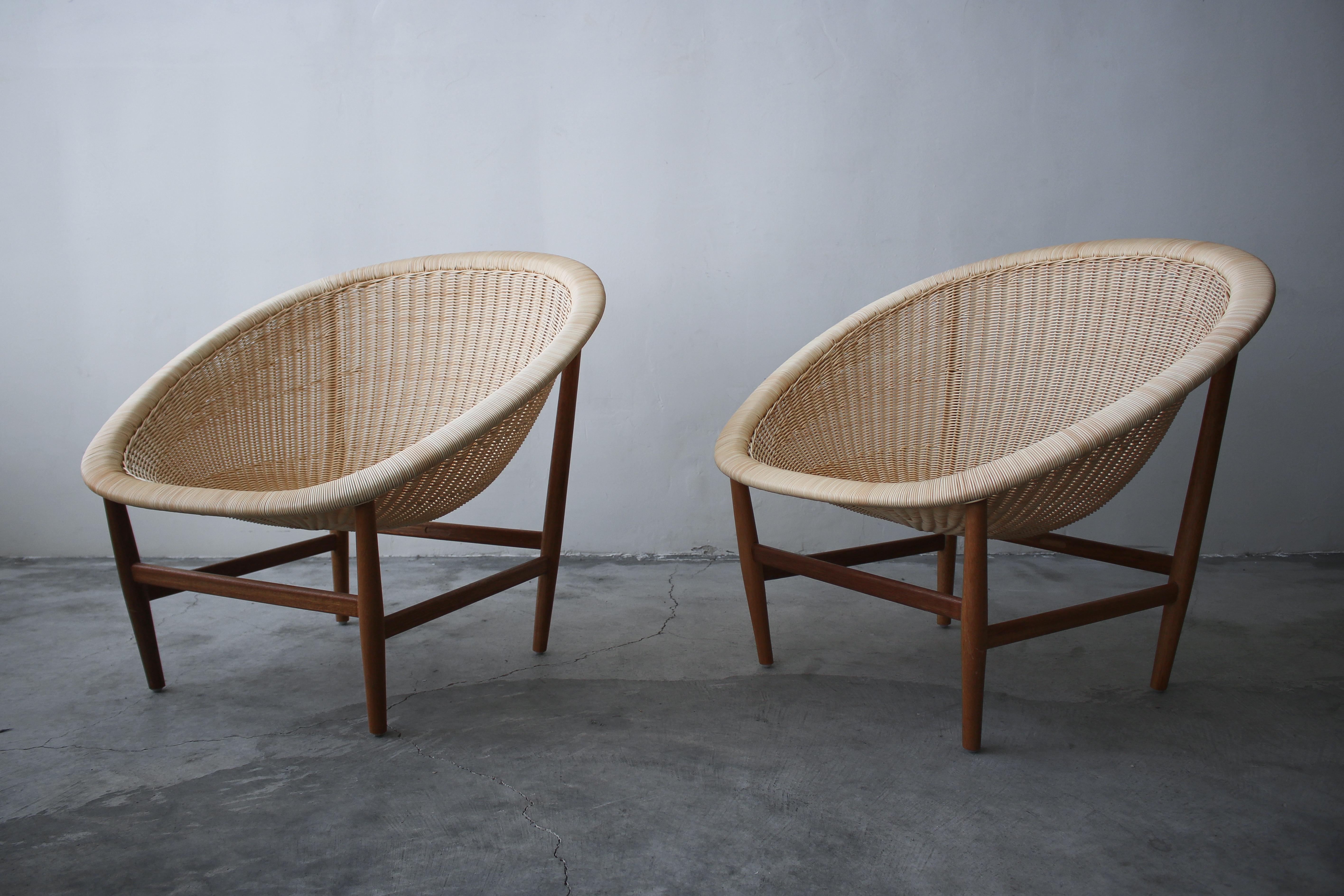 Designed by Nanna and Jørgen Ditzel in 1950, and edited and issued by Kettal in Barcelona Spain These beautiful Danish basket chairs are 1 of 2 designs issued by Kettal, this one designed for outdoor use is constructed of teak and artificial fibre