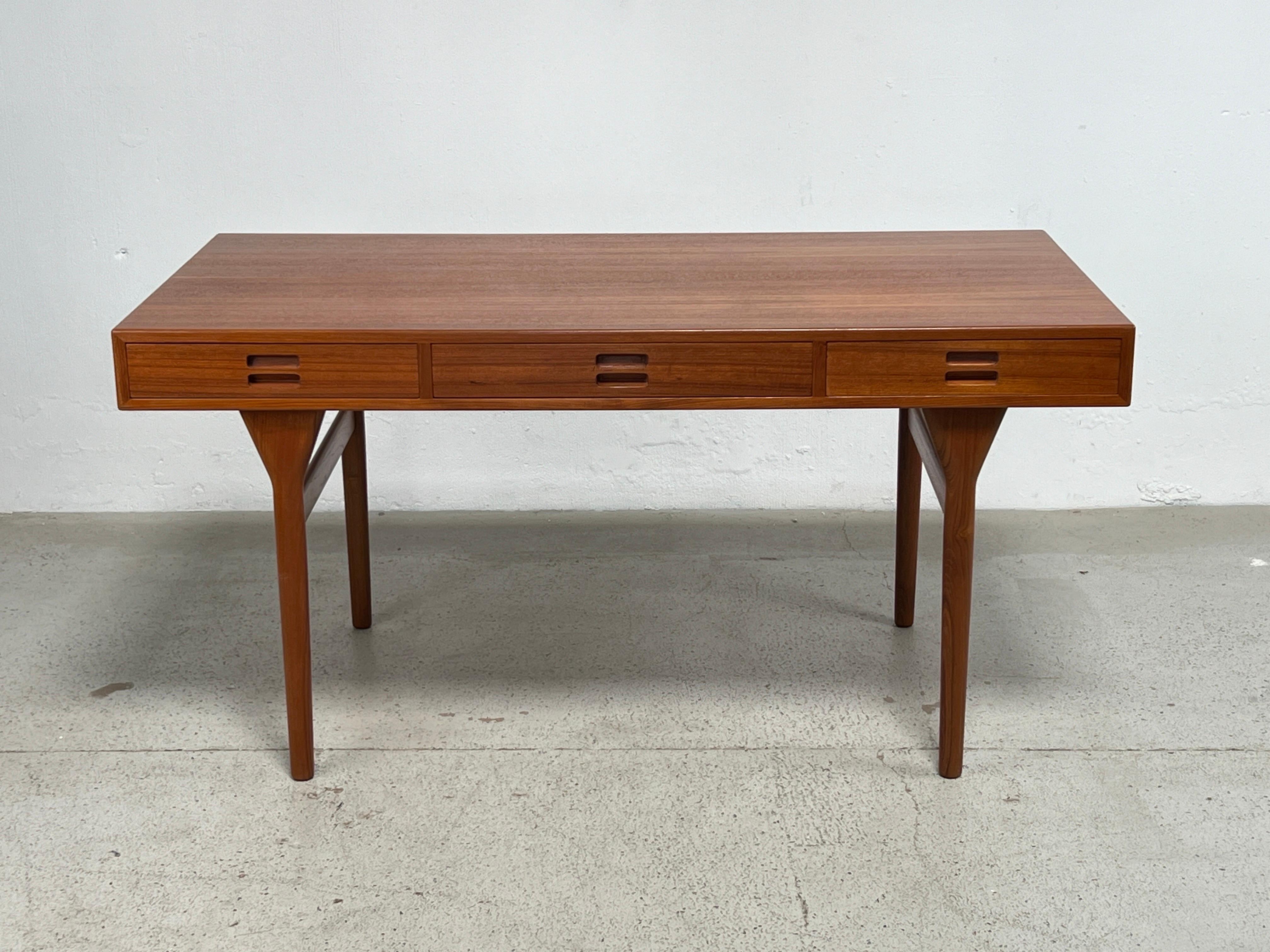 Three drawer teak desk by Nanna Ditzel for Søren Willadsen. 