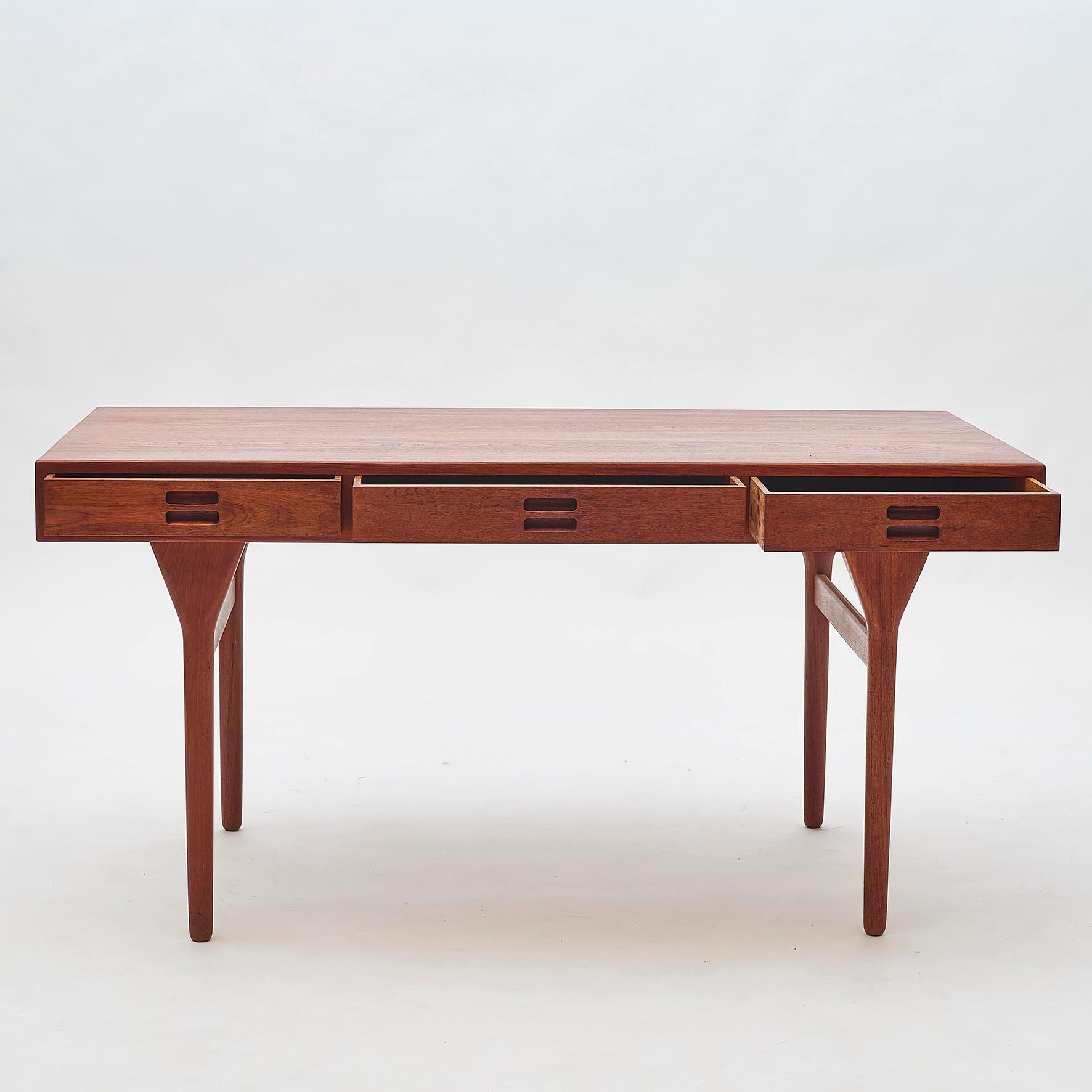 Desk by Danish designer Nanna Ditzel, 1955-1960, model ND93. Fine lines and robust structure in teak with 3 deep drawers. Manufactured by Søren Willadsen, Vejen.