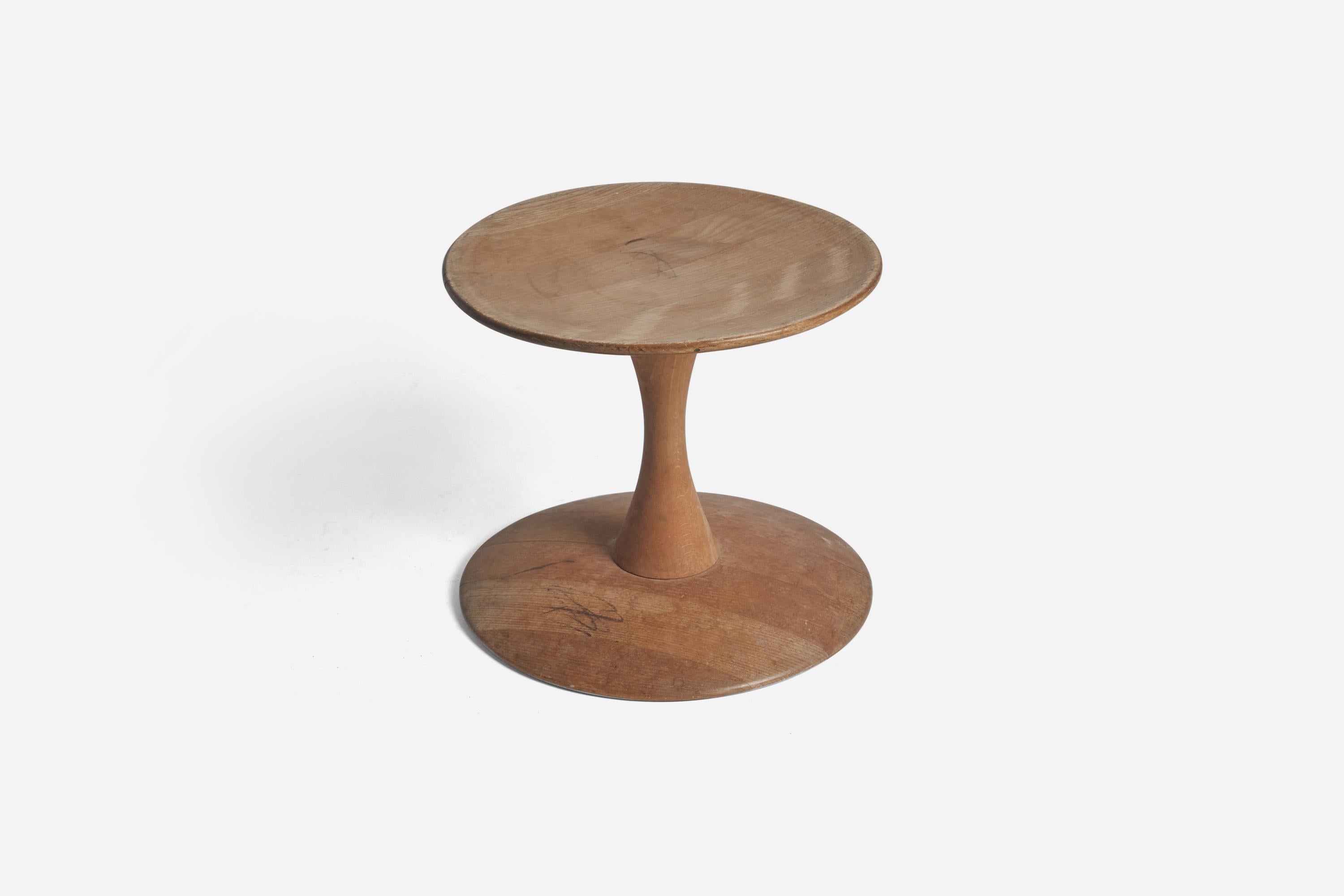 A beech stool designed by Nanna Ditzel and produced by Kolds Savværk, Denmark, 1962. 