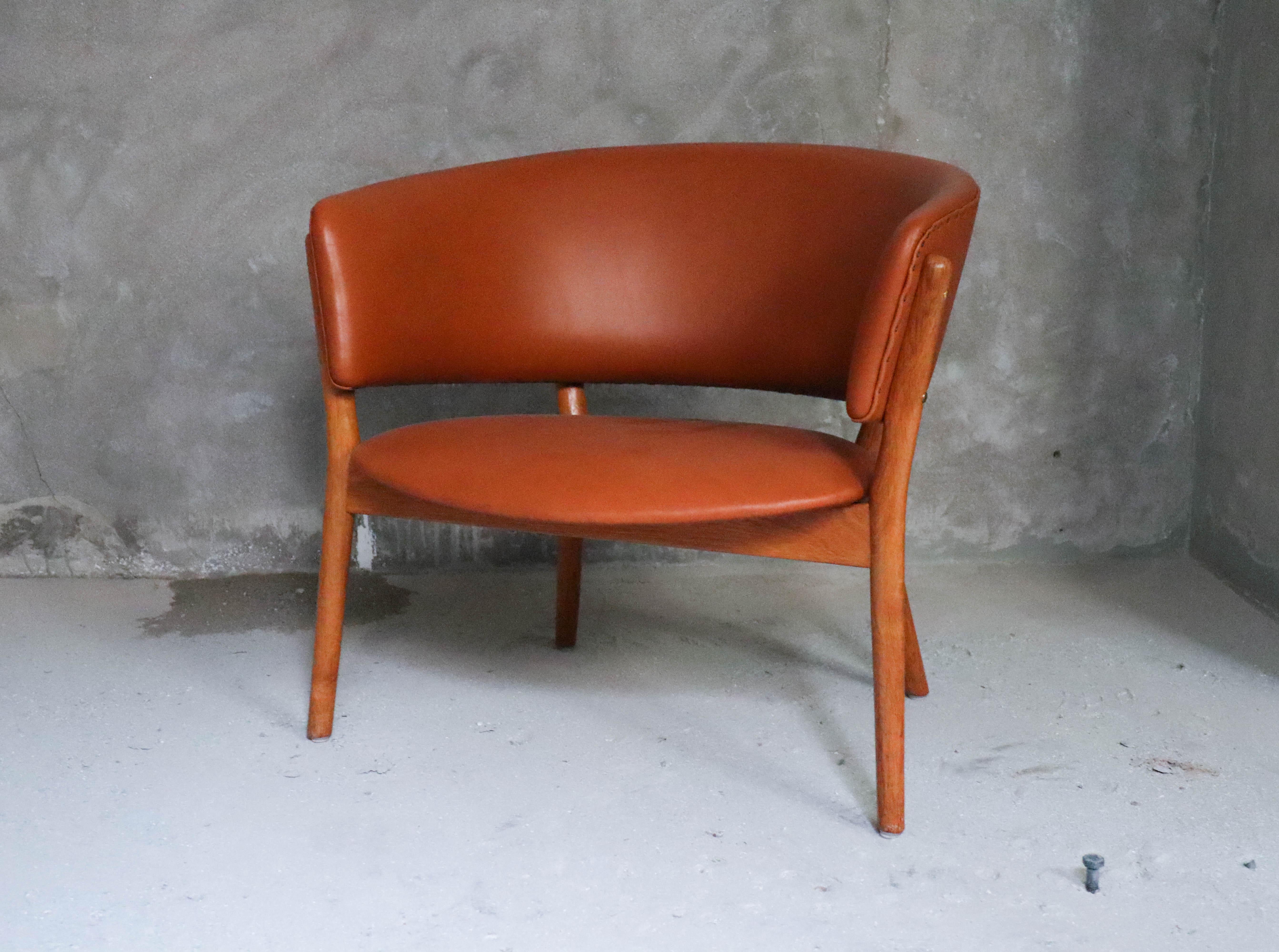 A beautiful lounge chair ND 83 designed by Nanna Ditzel and produced by Søren Willadsen. This one is reupholstered in leather, it do has a few marks in the leather.

 