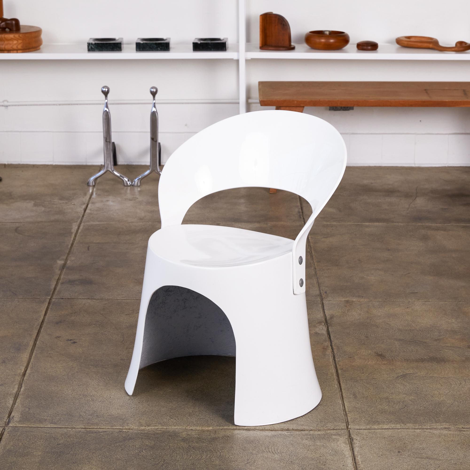 A single white fiberglass side chair by Nanna Ditzel for Odense Maskinsnedkeri. The Model 5301-2 was produced for retail by Domus Danica beginning in 1969 and has a simple, two-part construction with a Space Age sensibility. An oblong fiberglass