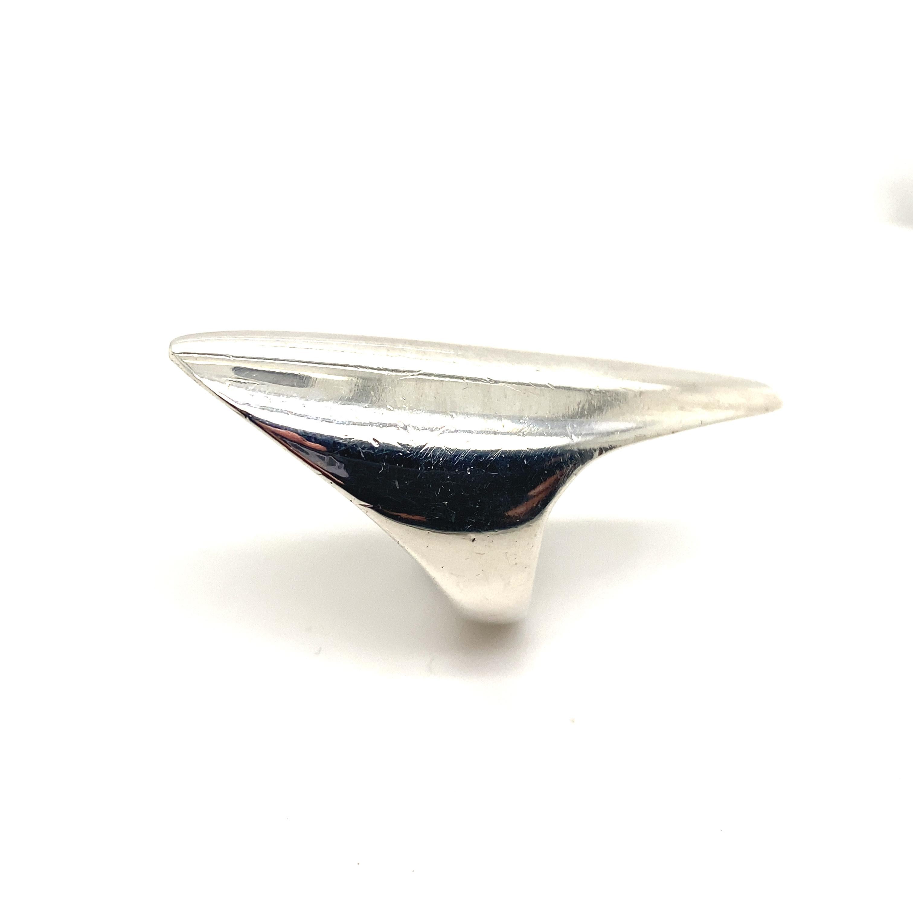 A Nanna Ditzel for Georg Jensen silver ring, Denmark circa 1960.

Designed as an elegant curved silver sculptural form, this ring sits beautifully on the finger, catching the light when viewed from different angles.

Nanna Ditzel (1923 - 2005) was